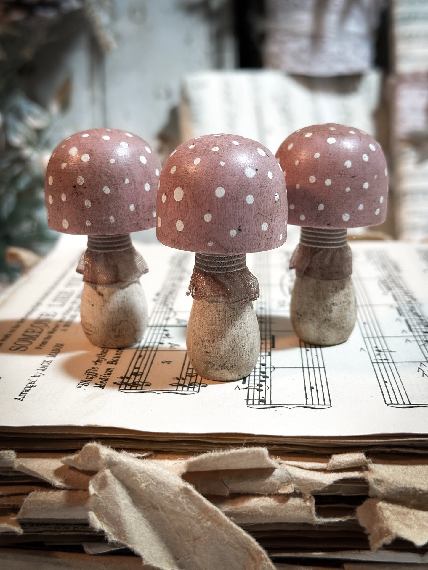 A wooden hand painted and trimmed Christmas village toadstool