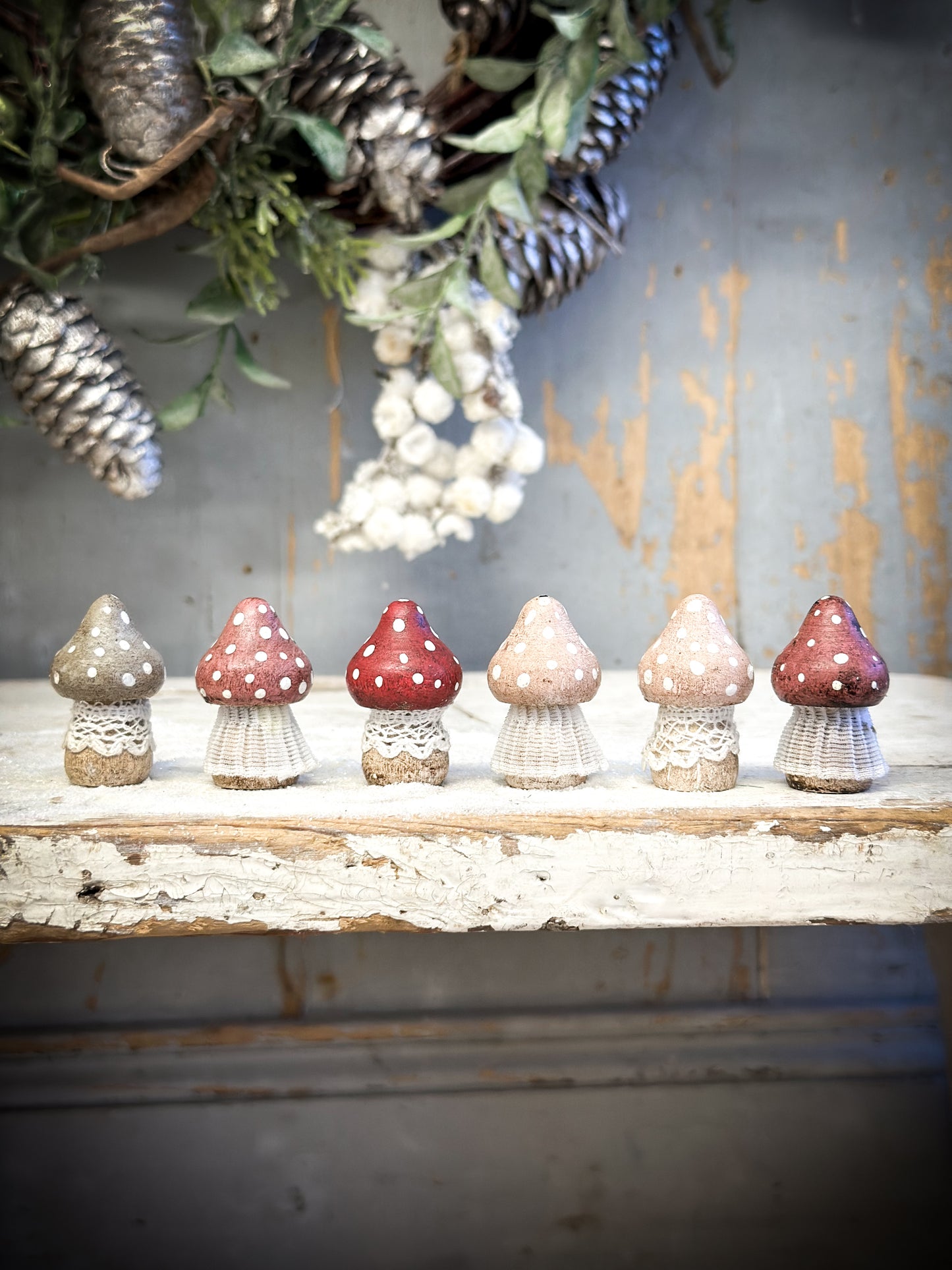 A wooden hand painted and trimmed Christmas village toadstool small pointy one