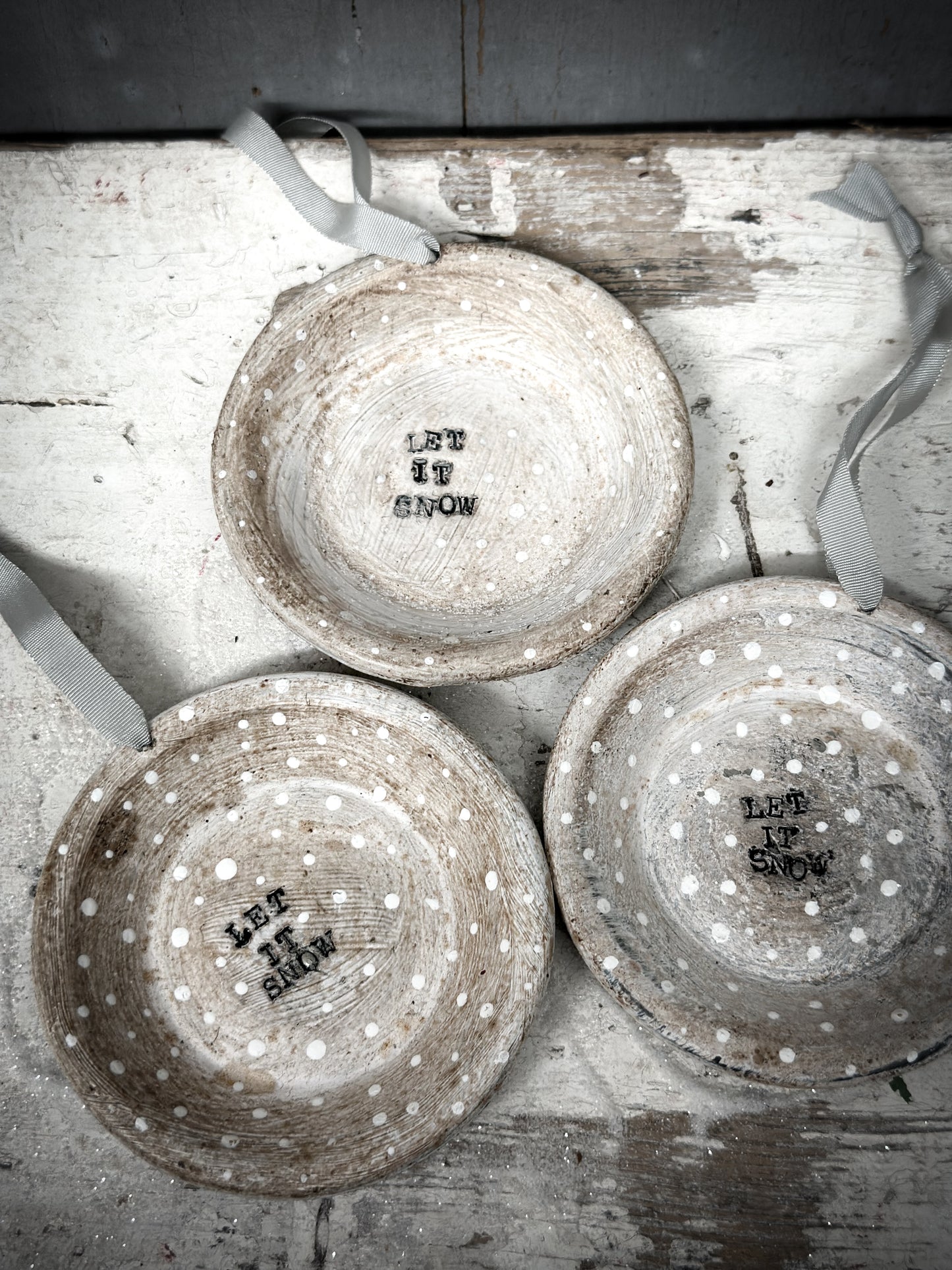 A Reworked French Patisserie Tin Christmas Decoration Stamped and Painted “Let It Snow”