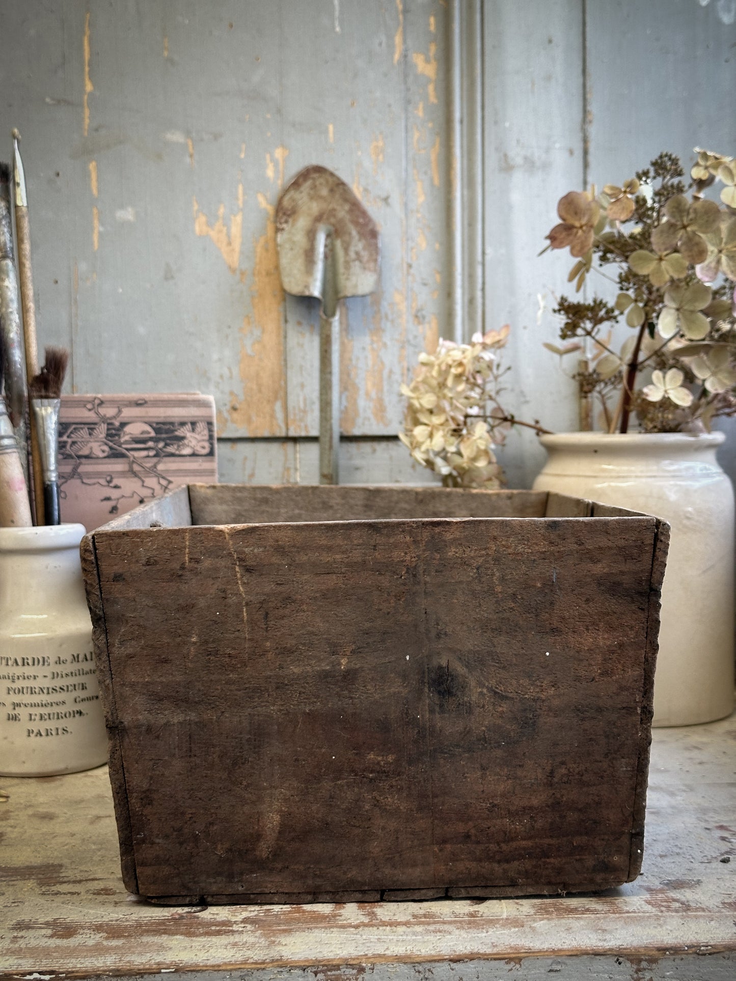 A Vintage Wooden Tomato Crate With Hand Painted Quote