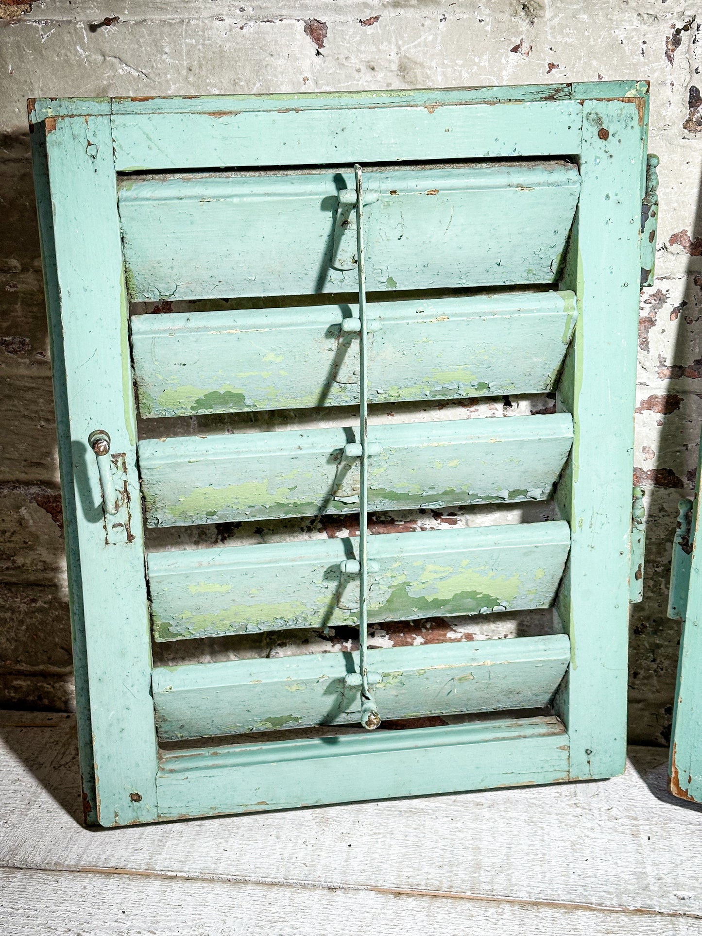 A Pair of French Green Chippy Painted Shutters