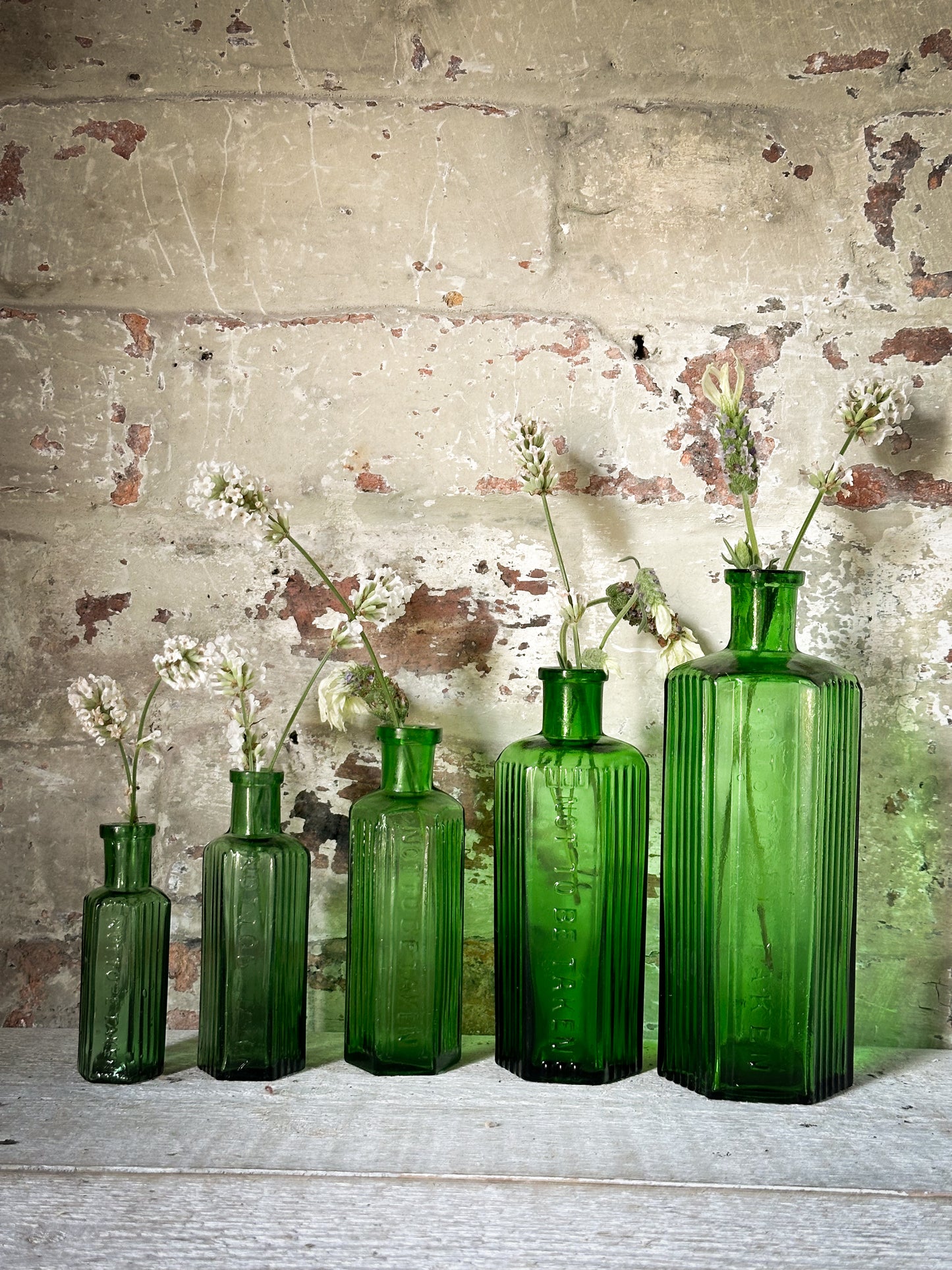 A set of Five lovely antique green poison bottles