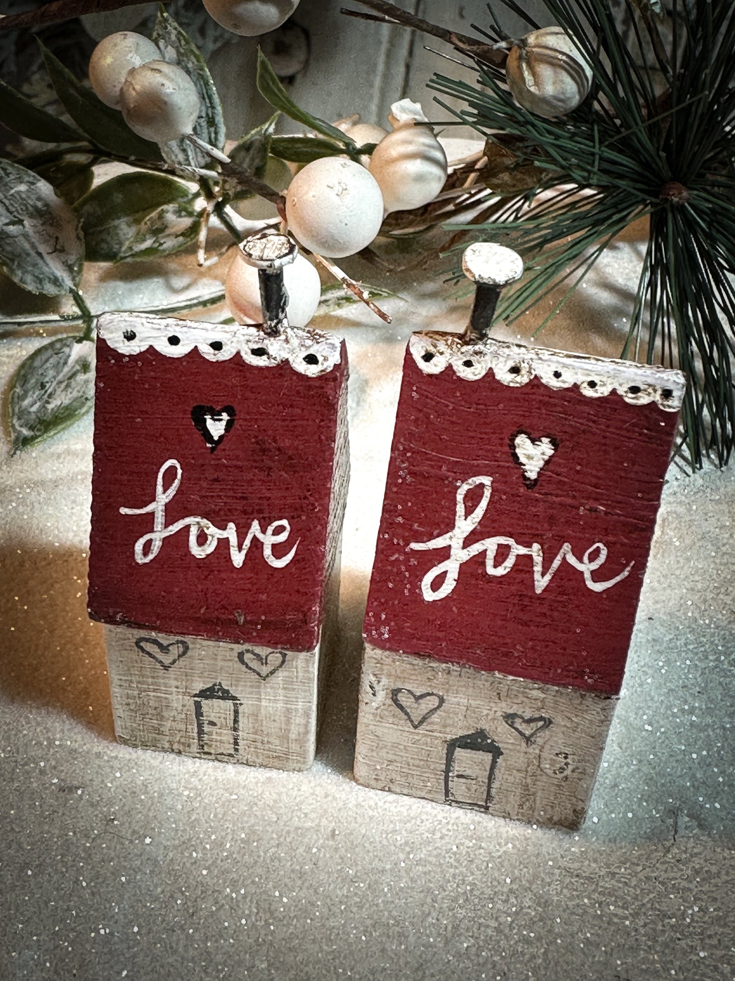 A pretty vintage German Erzgebirge Putz wooden village house painted with a Christmas quote