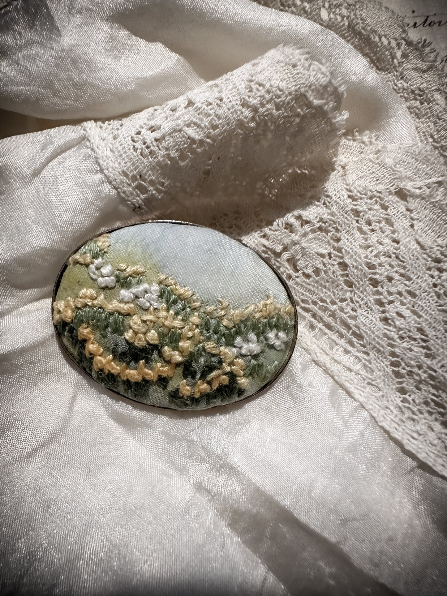 Vintage embroidered silk oval brooch