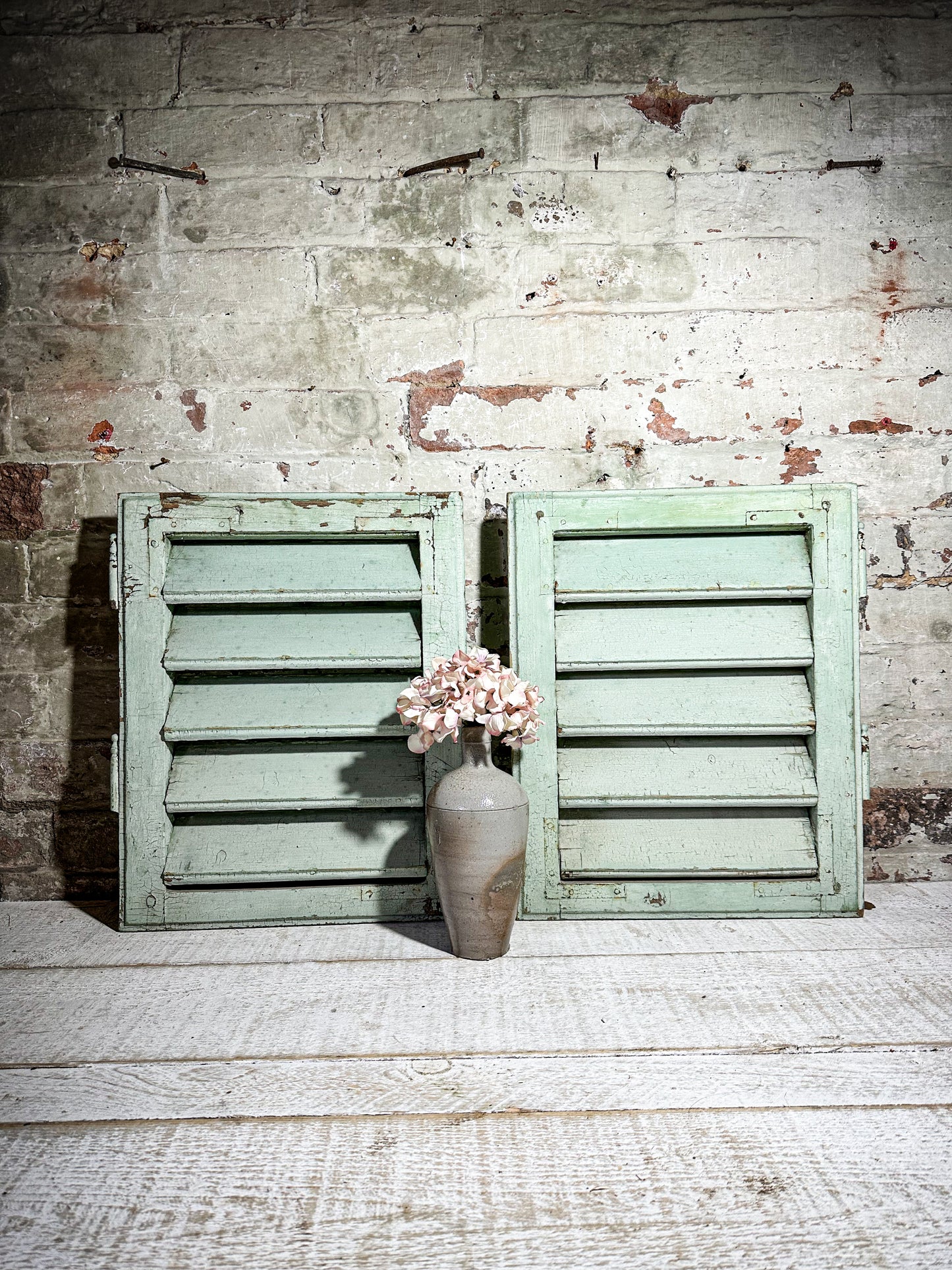 A Pair of French Green Chippy Painted Shutters