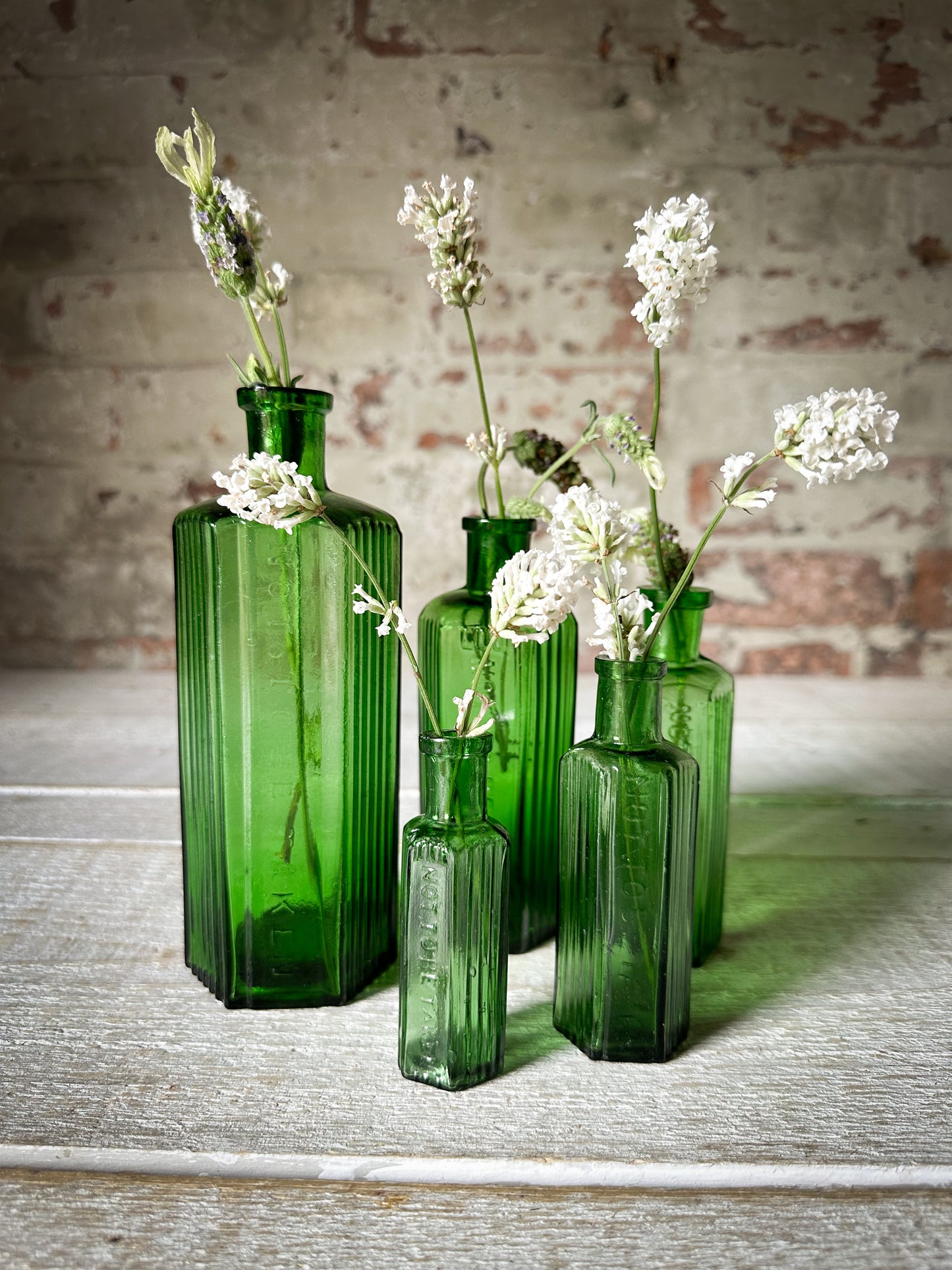 A set of Five lovely antique green poison bottles