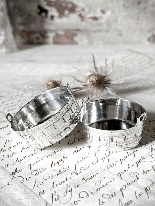 A pair of pretty silver plated mini churns