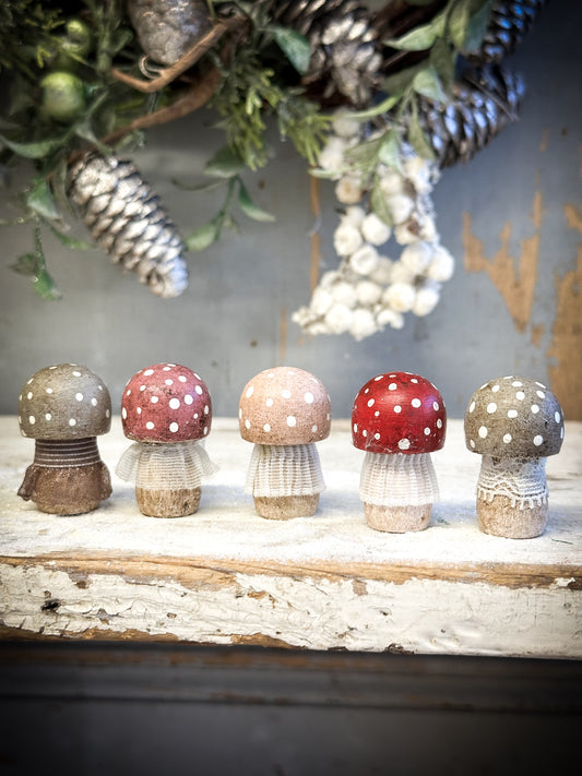 A wooden hand painted and trimmed Christmas village toadstool large capped one