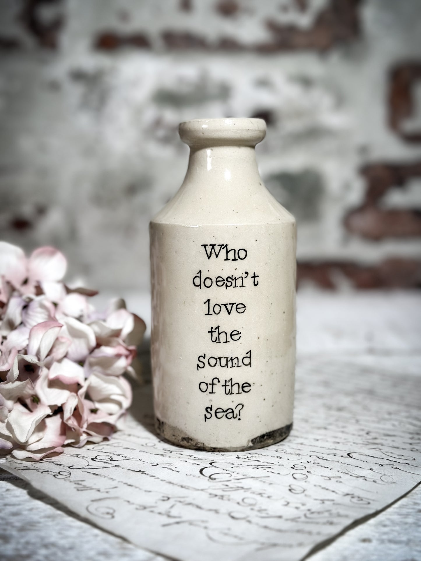 An Antique Pottery Bottle with a Hand Painted Inspirational Quote