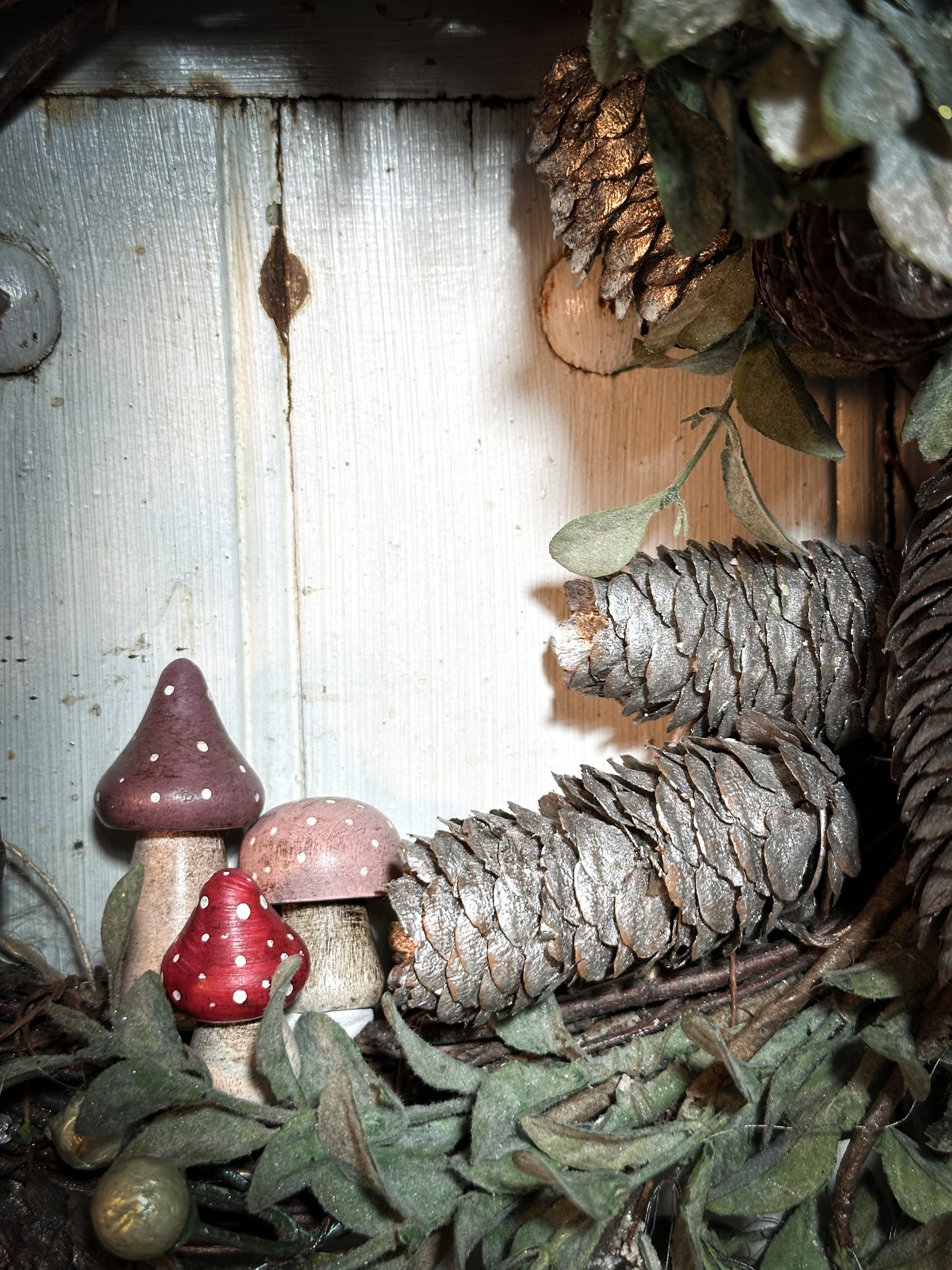 A wooden hand painted Christmas village toadstool