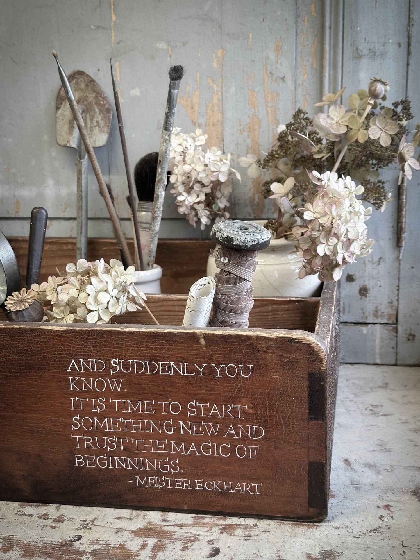A Vintage Wooden Drawer With Hand Painted Quote
