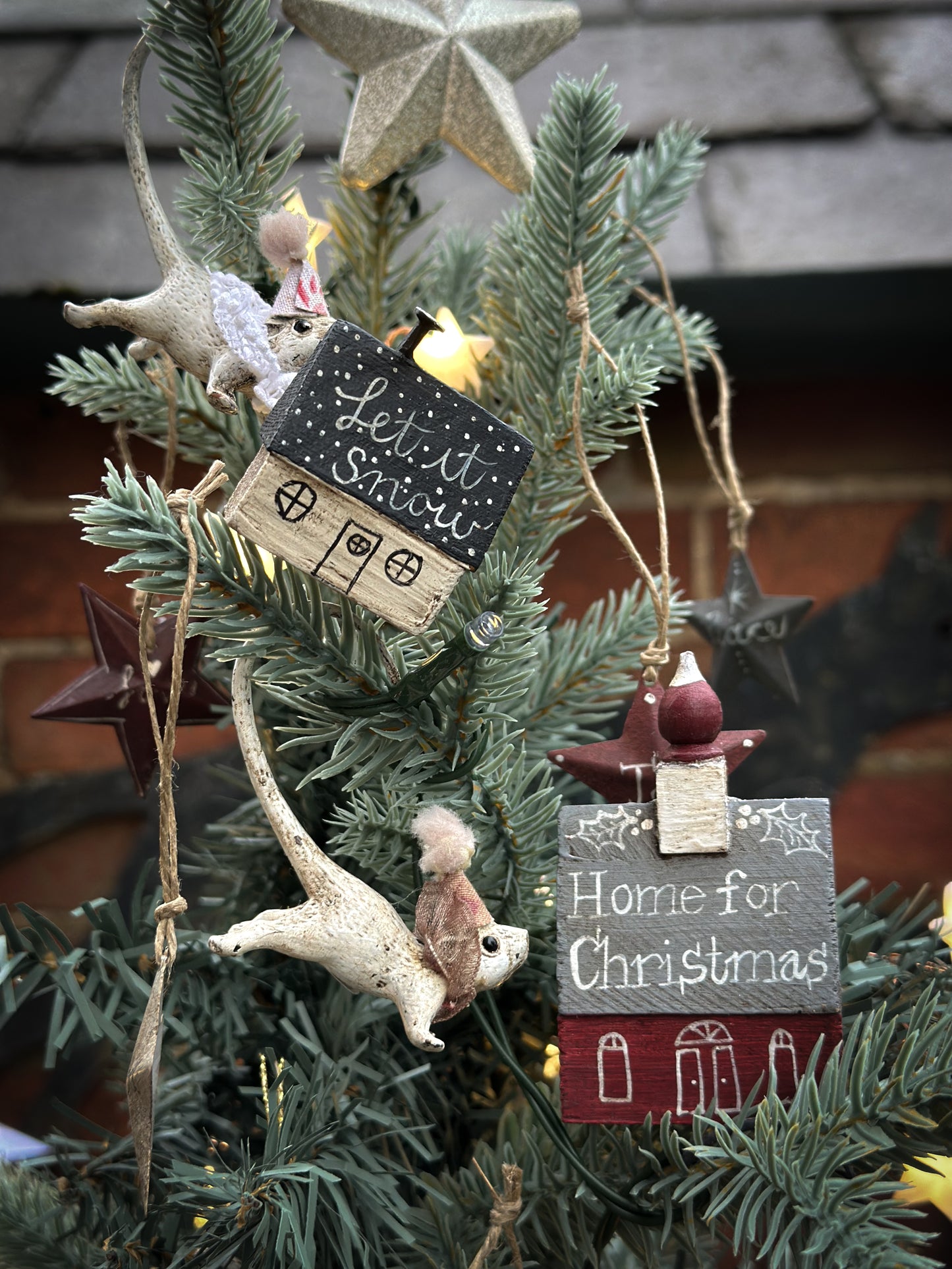 A pretty vintage German Erzgebirge Putz wooden village house painted with a Christmas quote