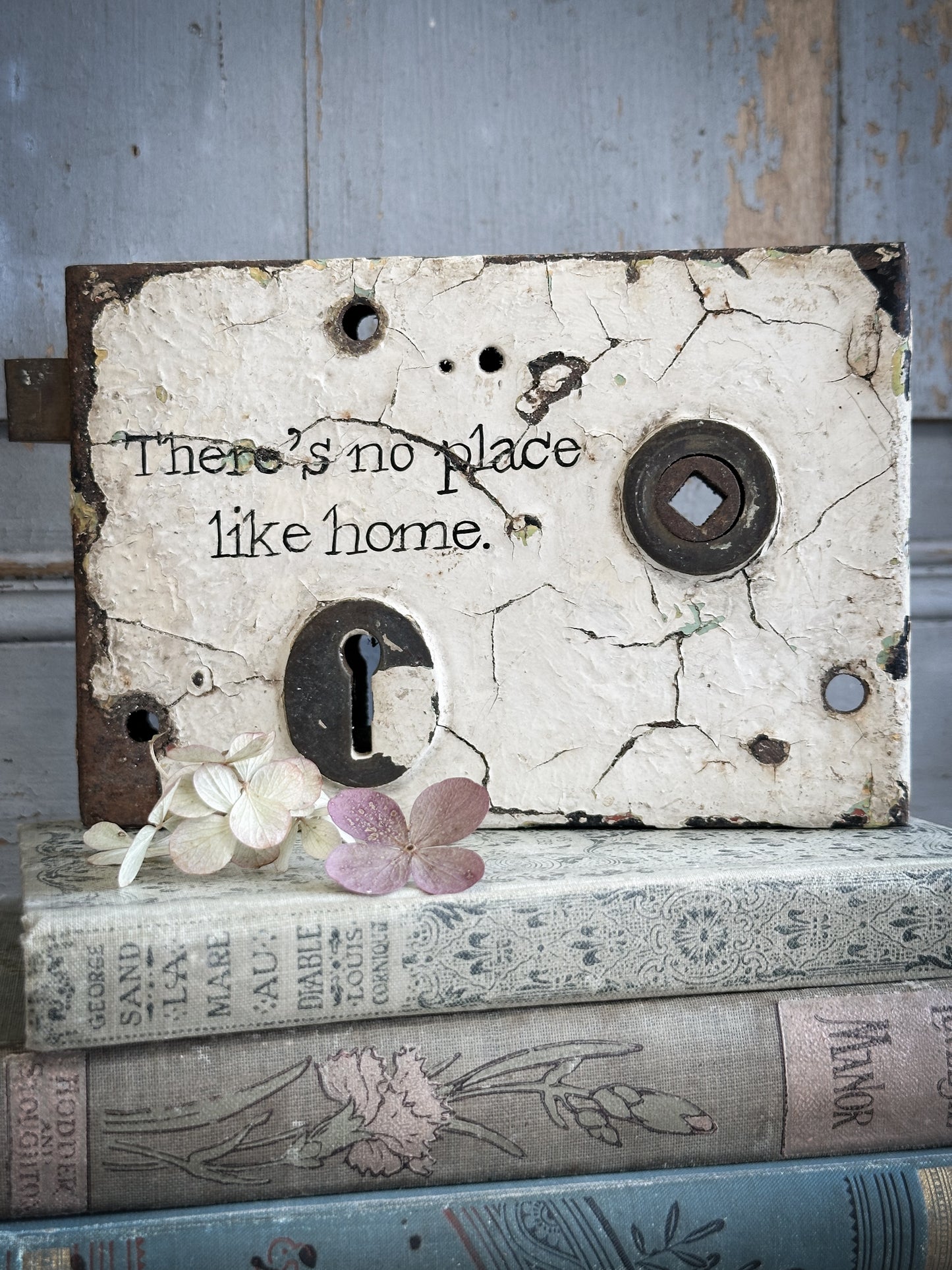 An Antique Lock With Hand Painted Quote