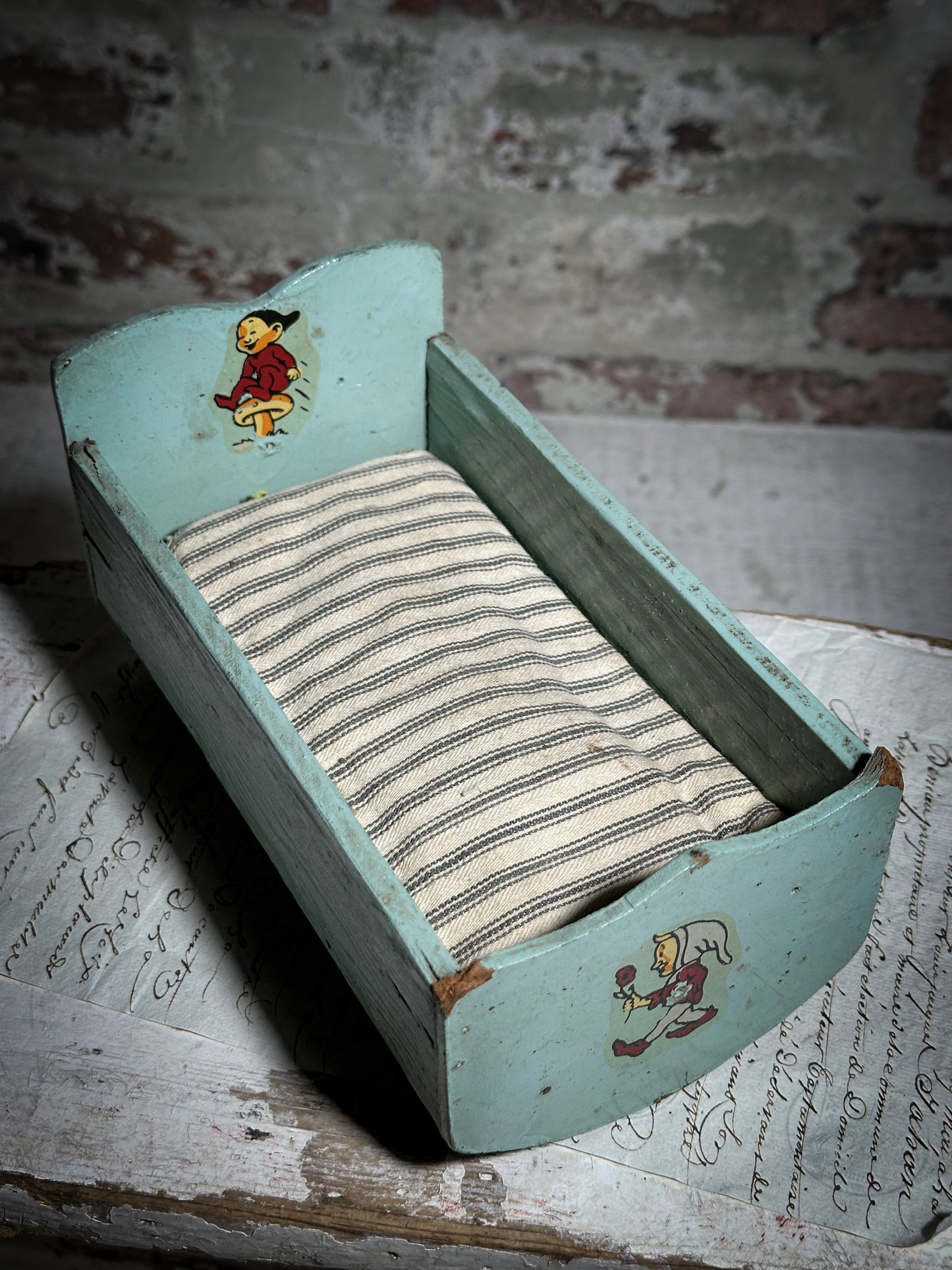 Vintage doll cradle with French ticking mattress