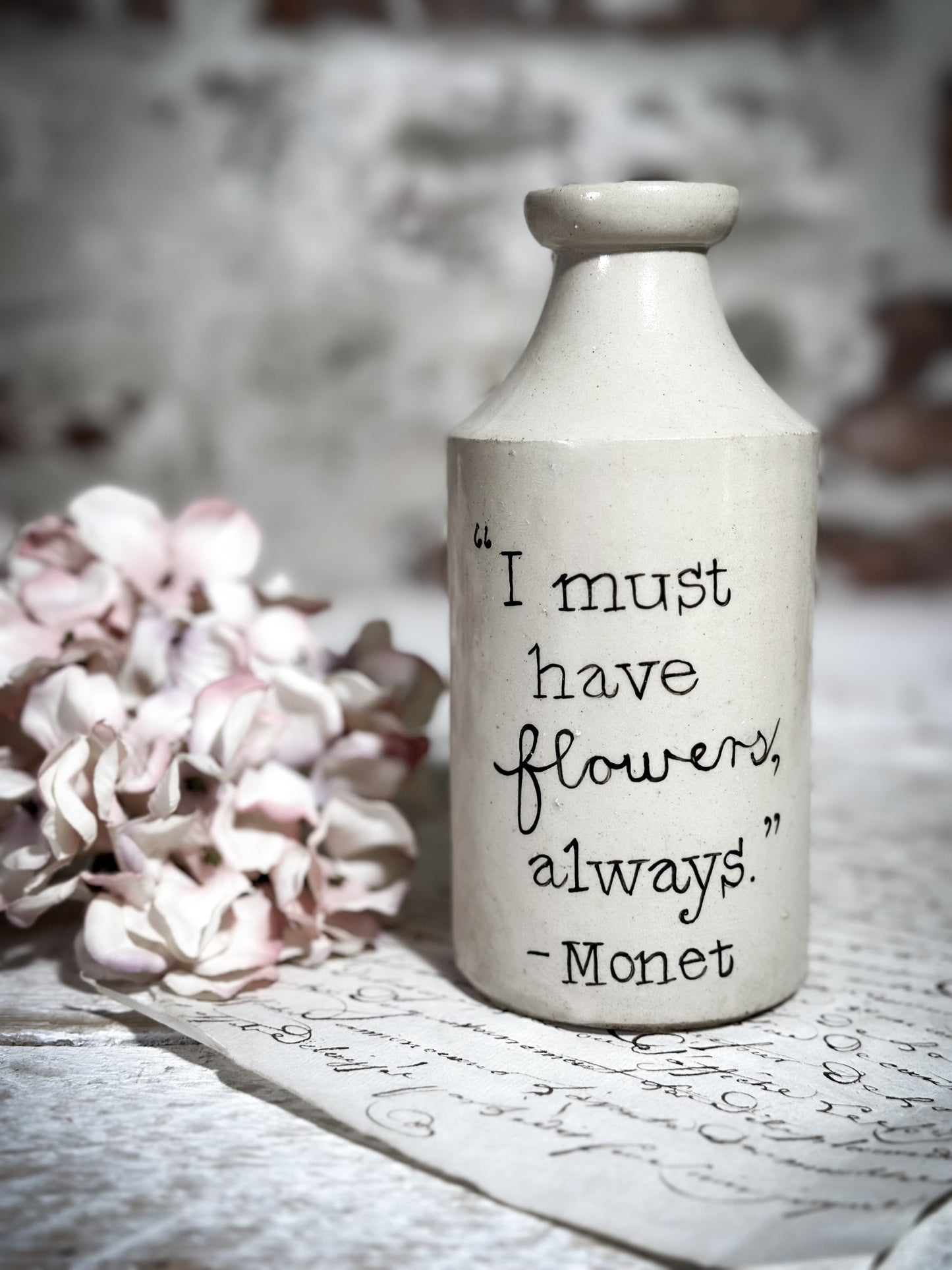 An Antique Pottery Bottle with a Hand Painted Inspirational Quote