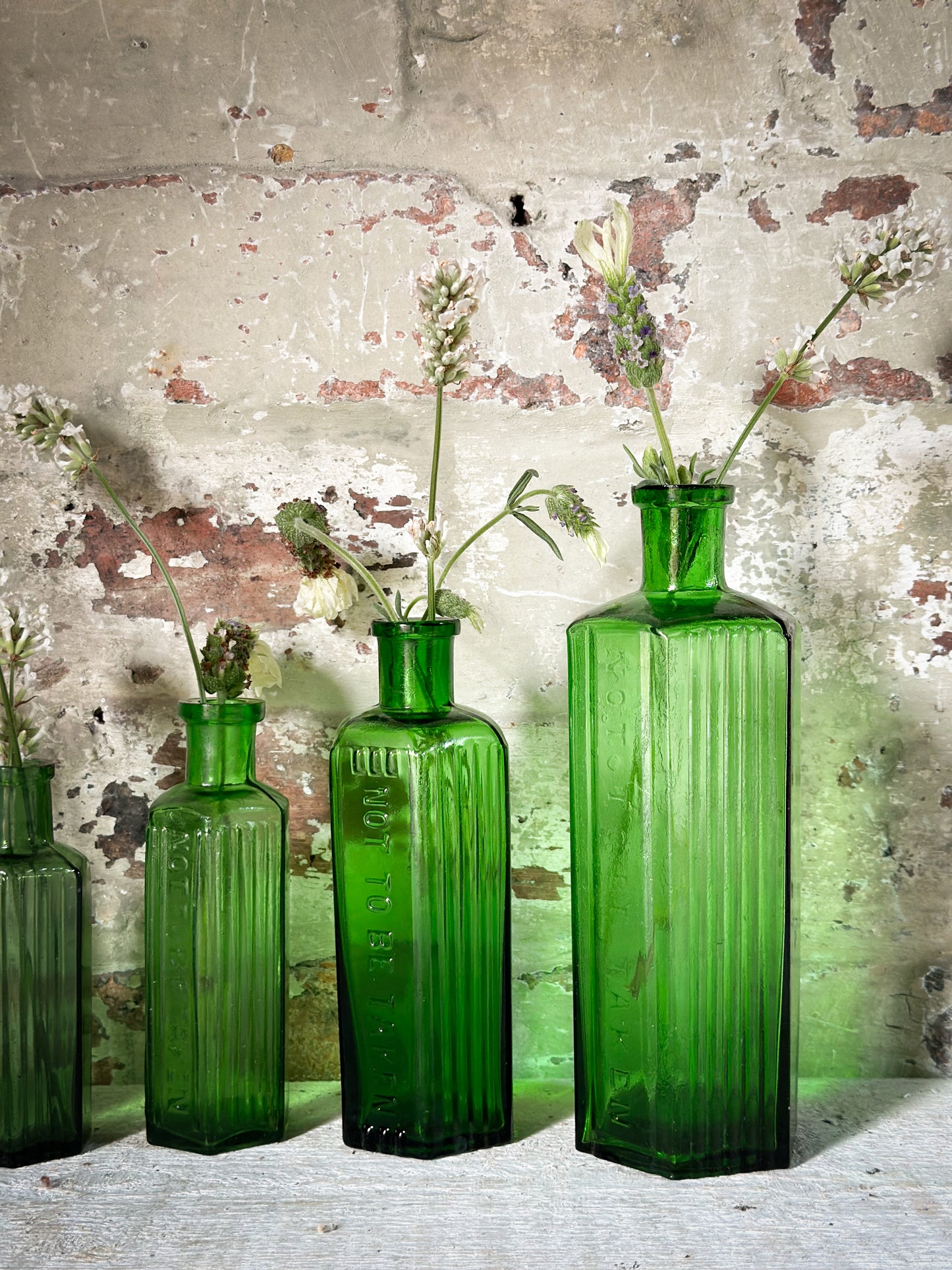 A set of Five lovely antique green poison bottles