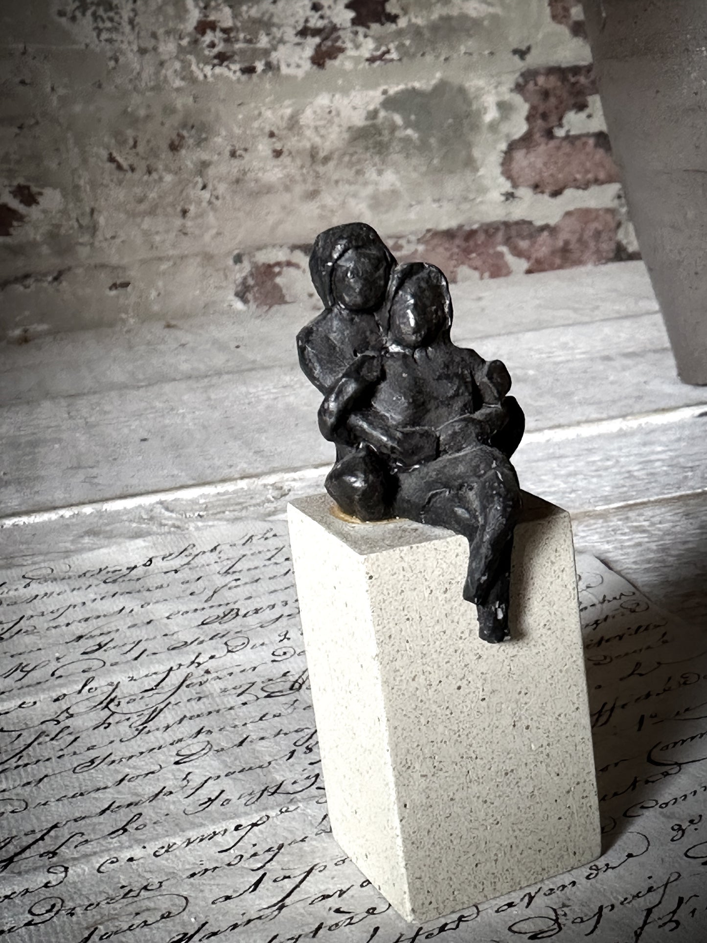 A Vintage Mini Sculpture of an Embracing Couple