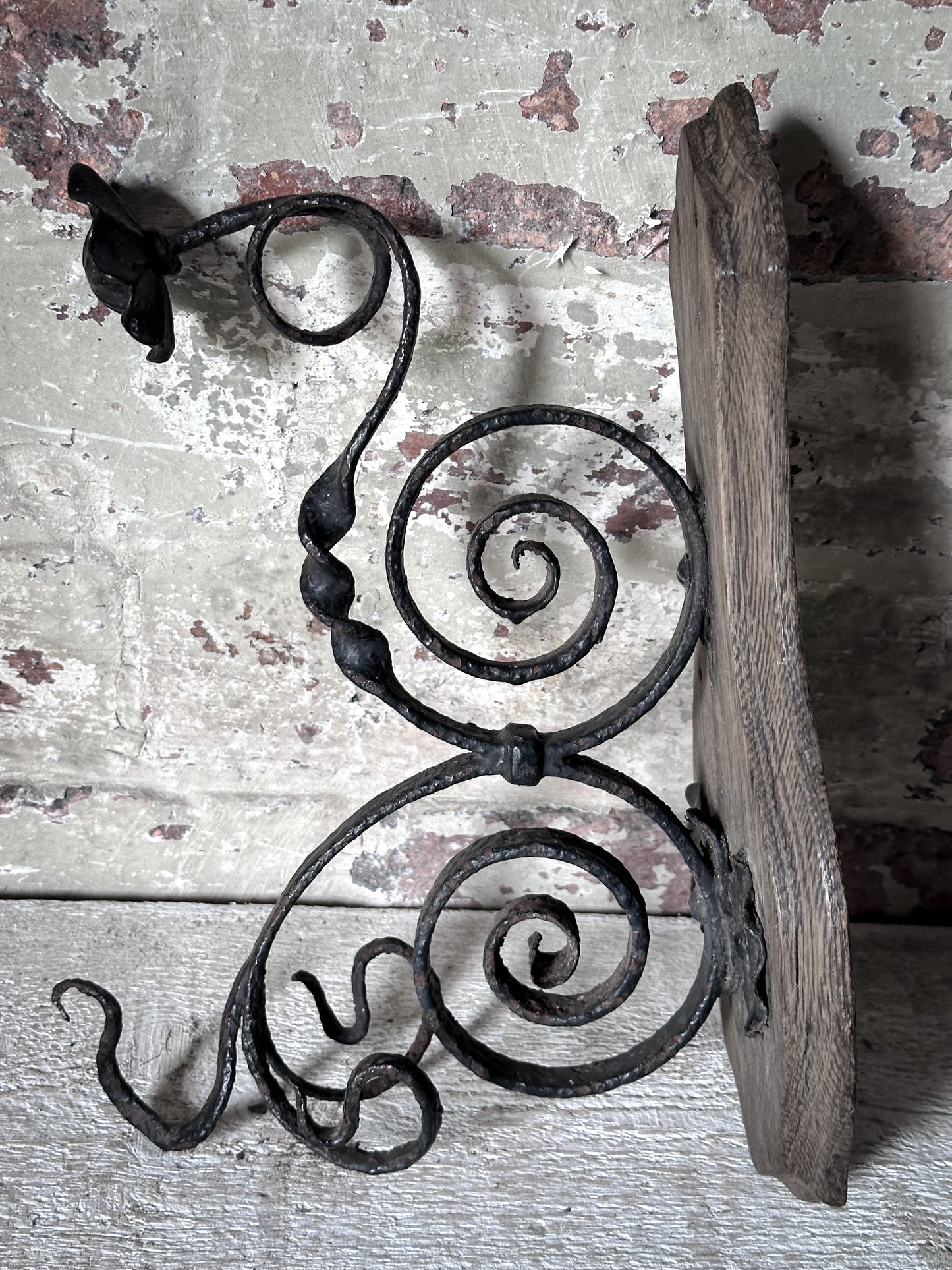 Antique Hand-Forged Wrought Iron Wall Bracket | Folk Art Scrollwork Hook on Wooden Backplate