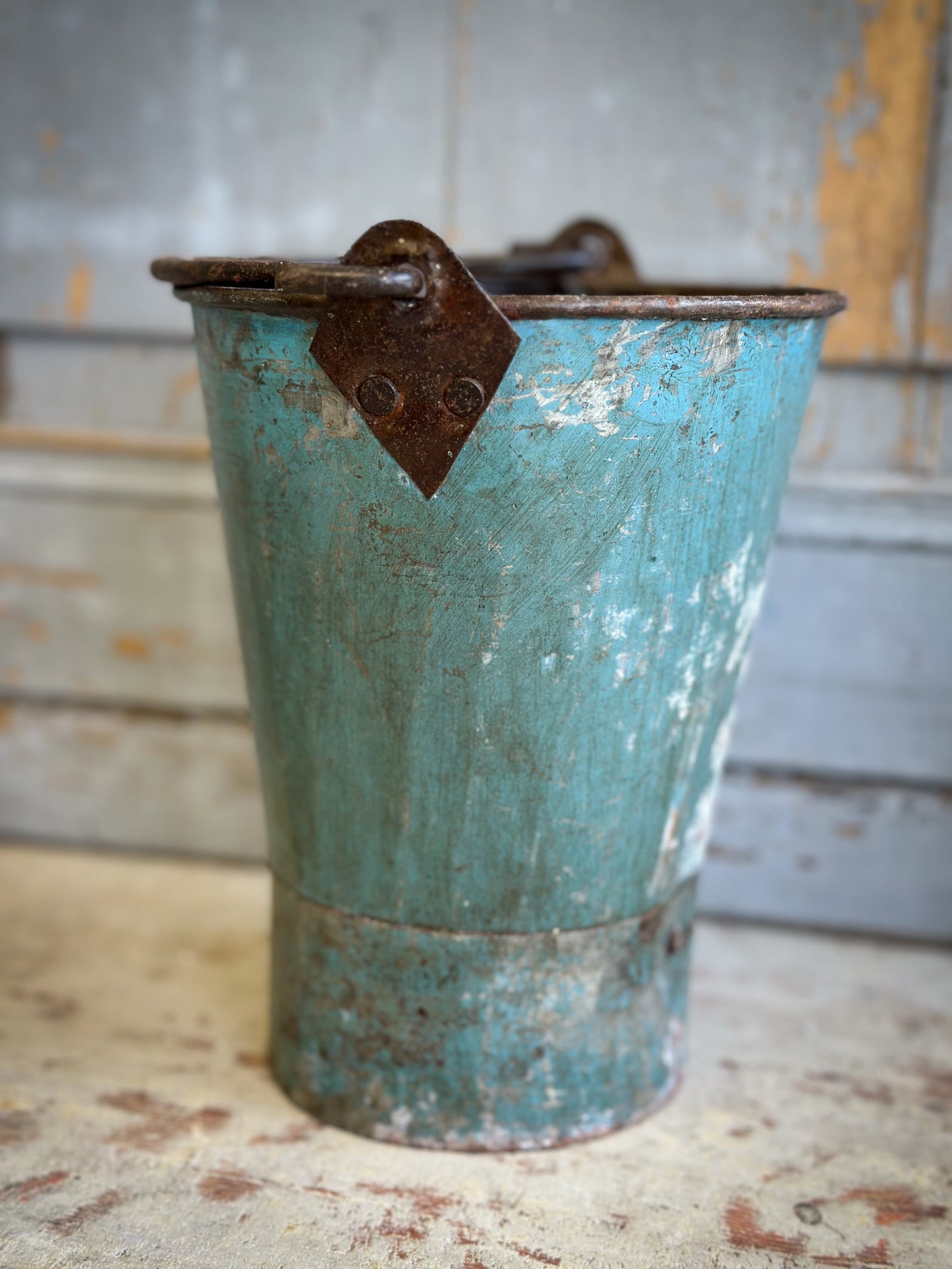 A Recycled Metal Mini Christmas Tree Bucket With A Hand Painted Quote