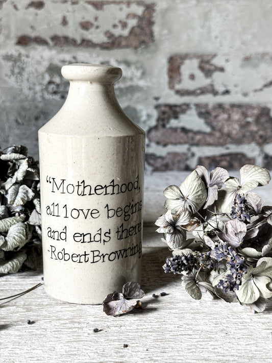 A Victorian unearthed stoneware pottery tall bottle with a hand painted quote