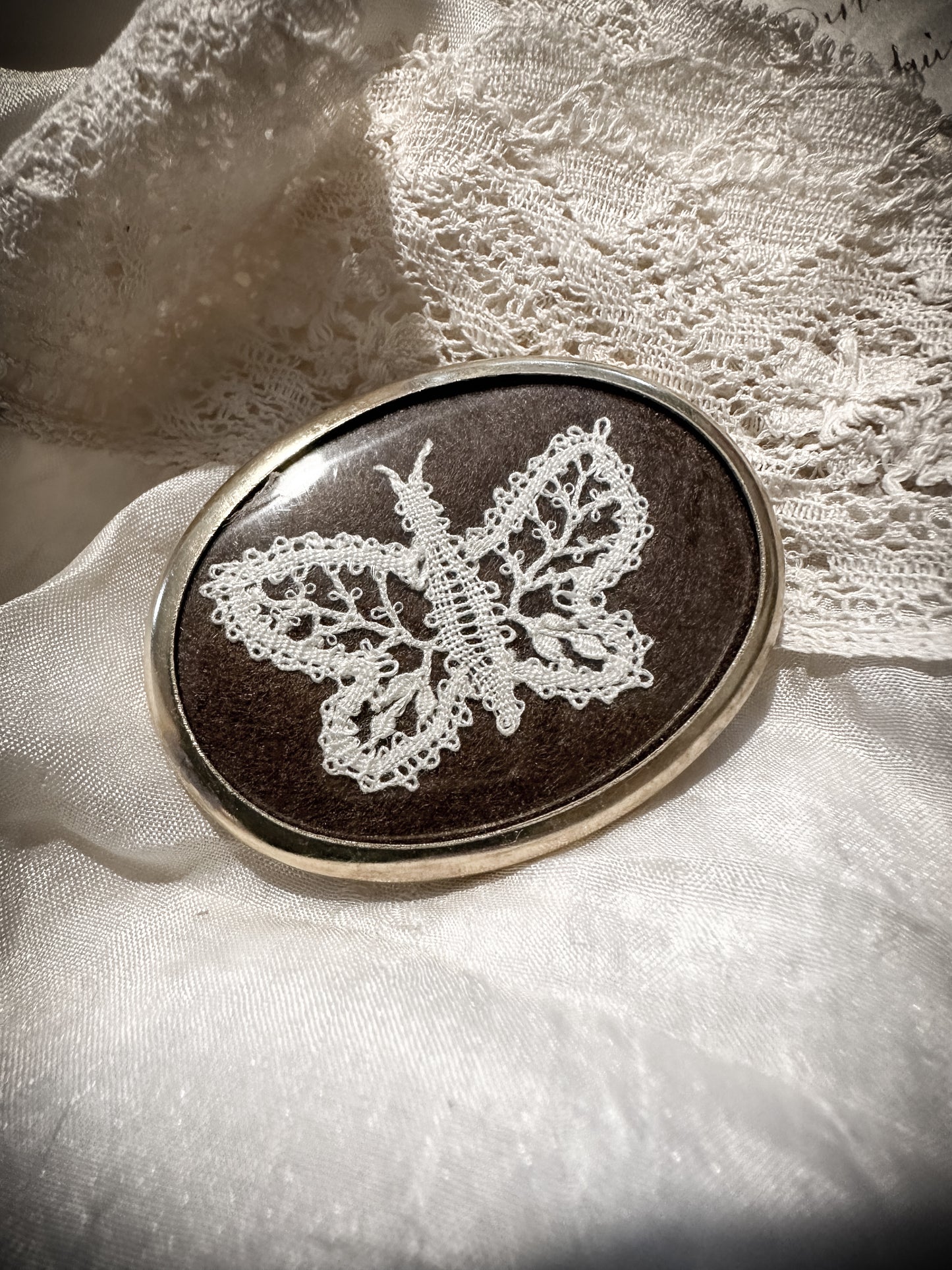 A vintage lace butterfly brooch