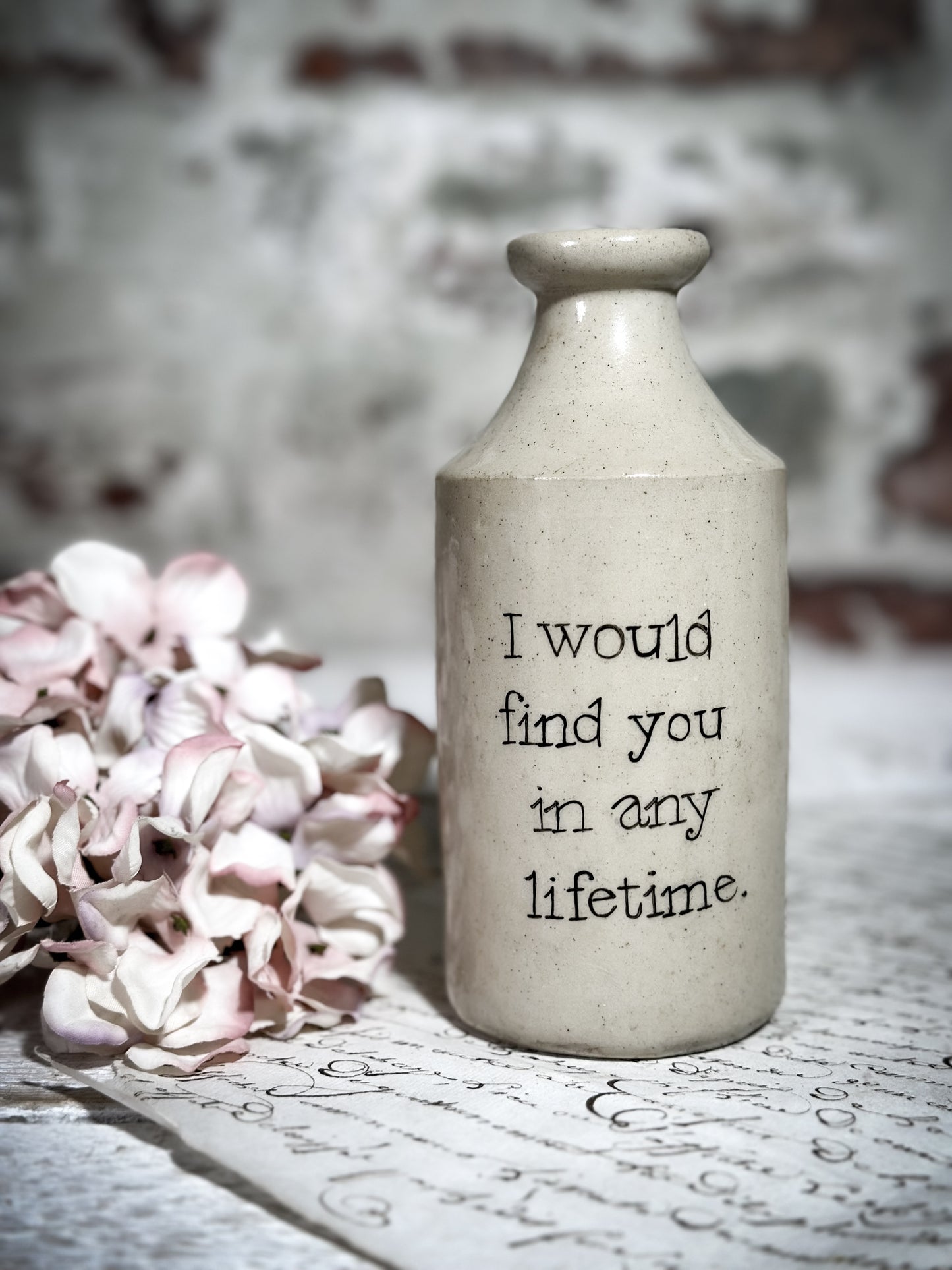 An Antique Pottery Bottle with a Hand Painted Valentine’s Day Quote