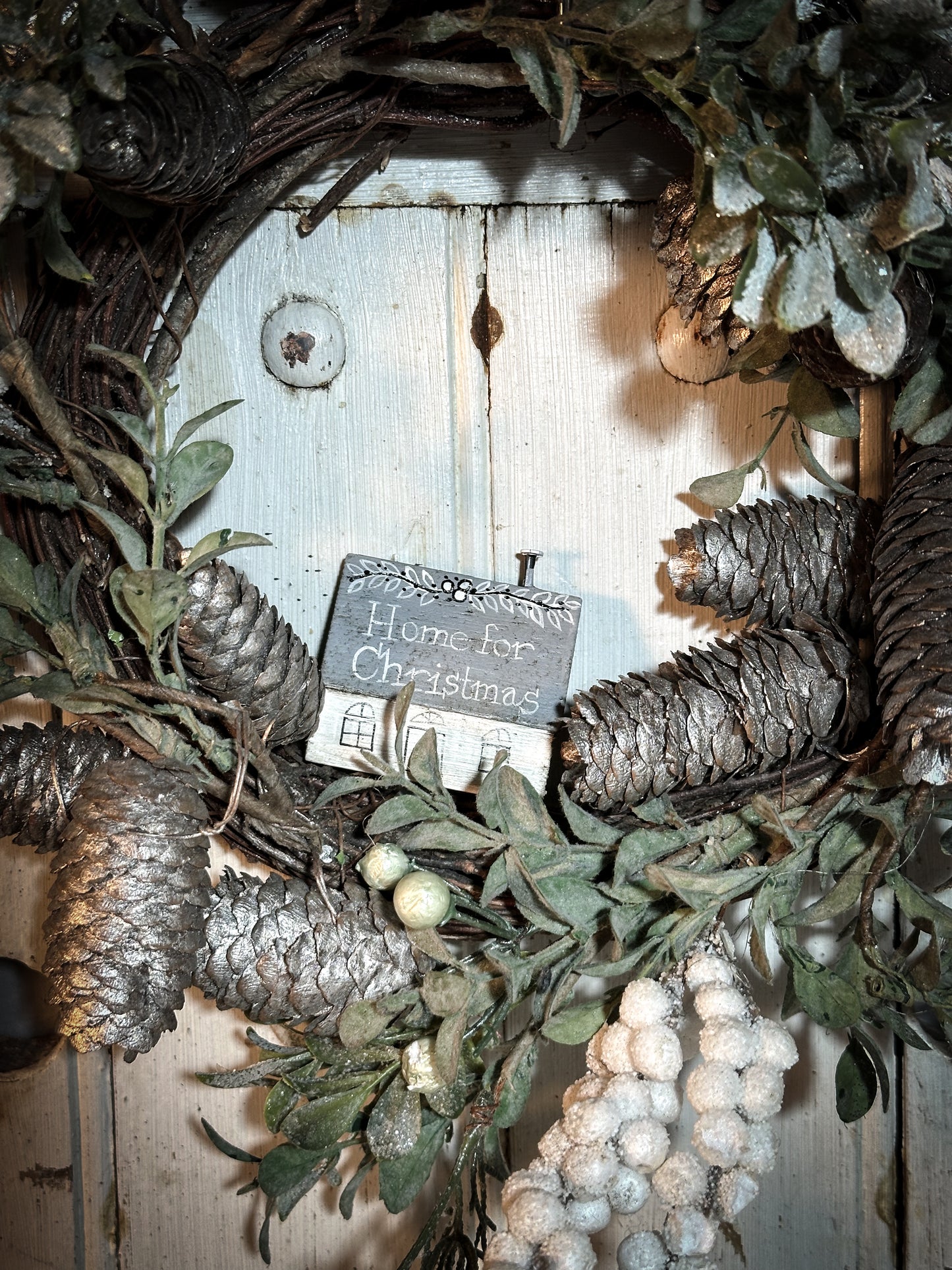 A pretty vintage German Erzgebirge Putz wooden village house painted with a Christmas quote