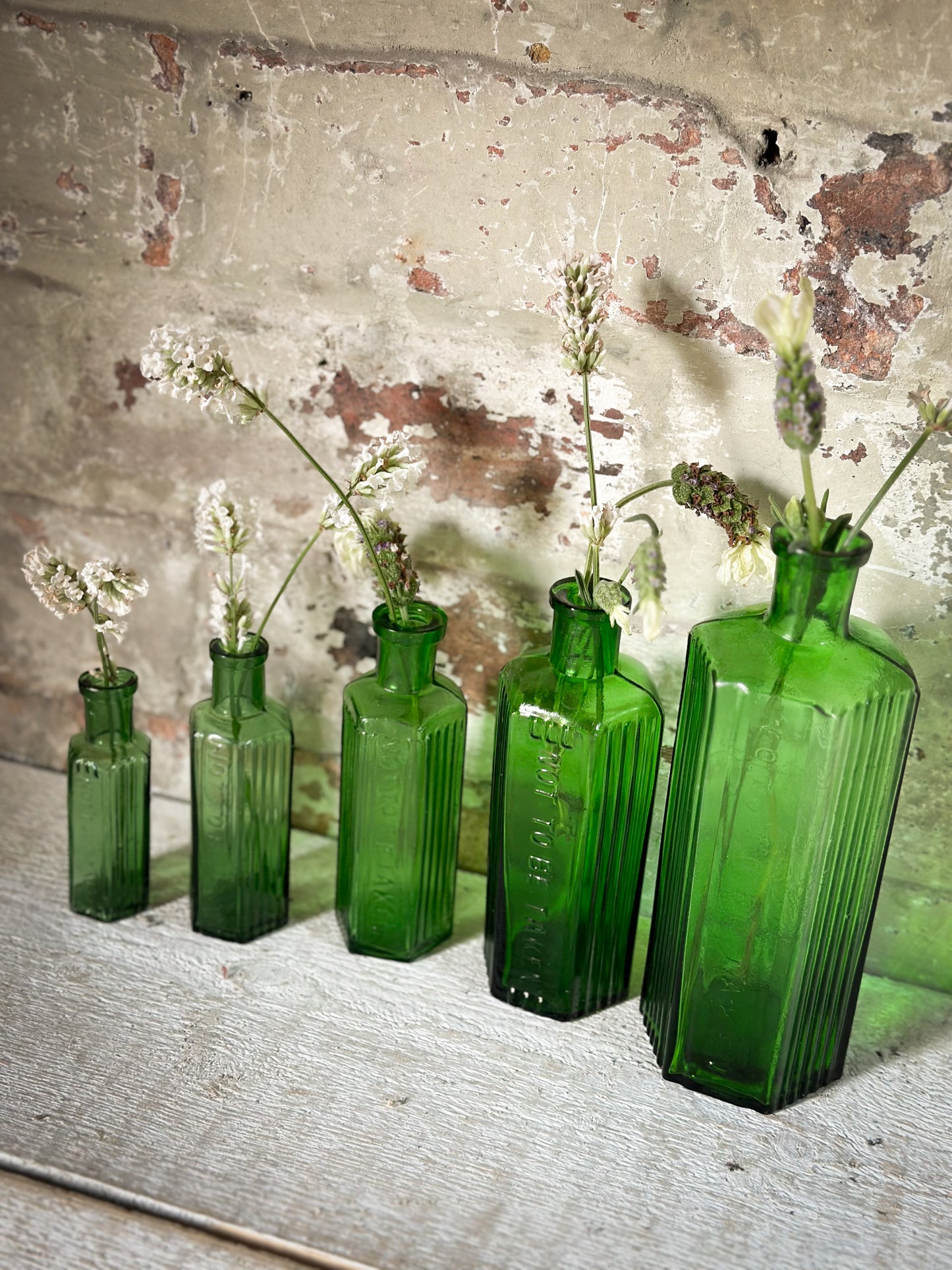 A set of Five lovely antique green poison bottles