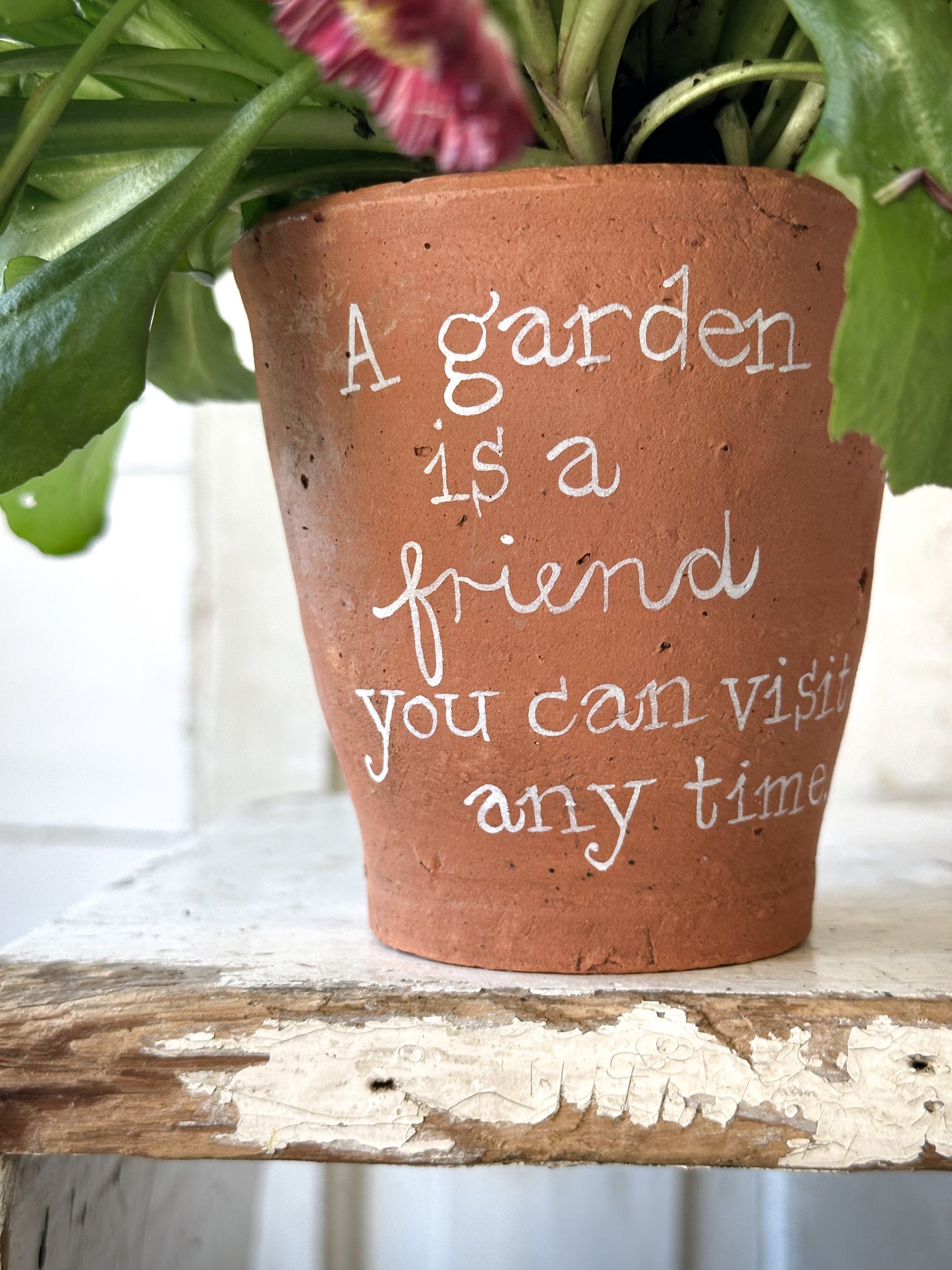 A Victorian terracotta pot with a quote