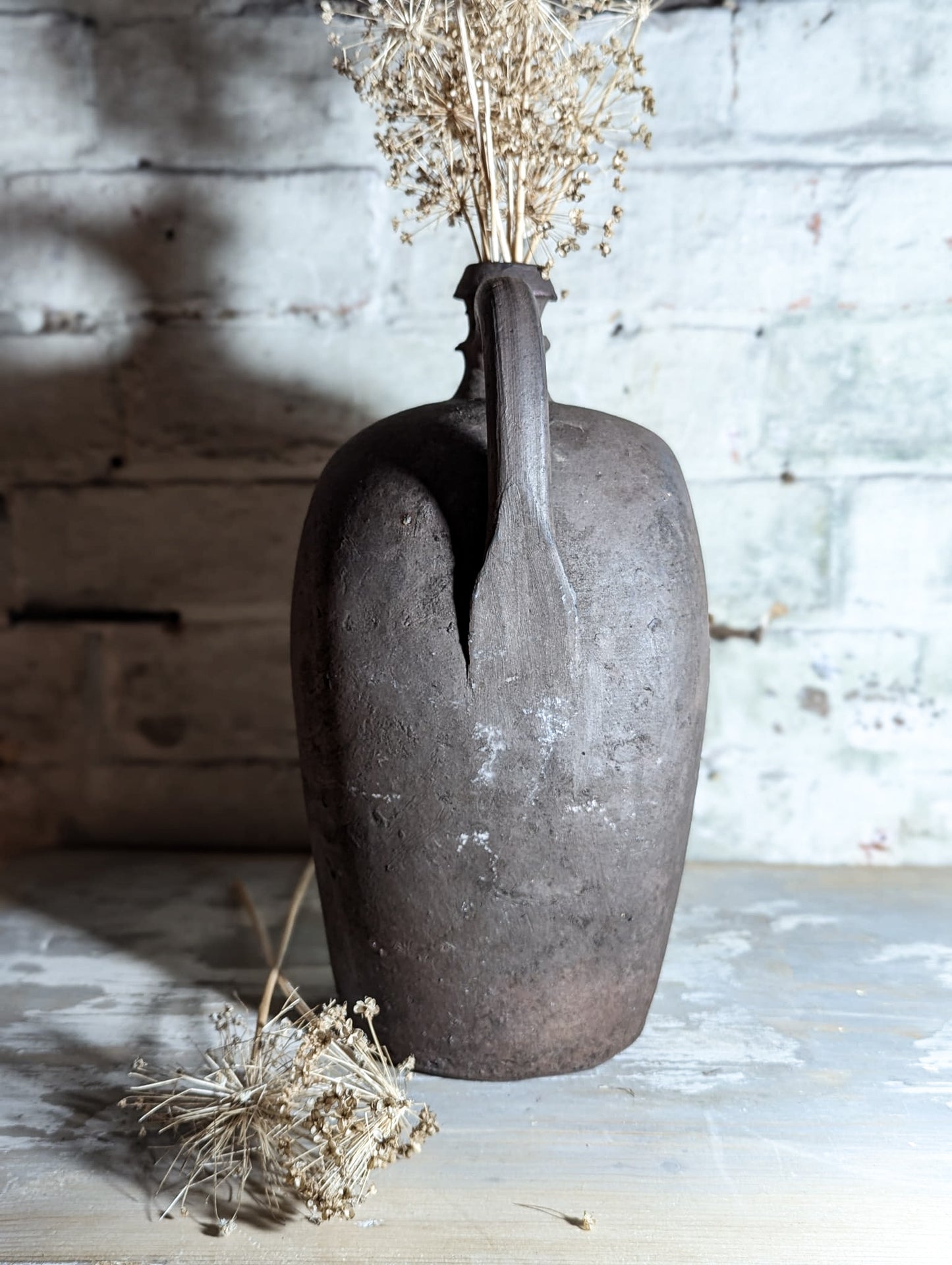 A stunning large Primitive French Antique Black Pottery oil bottle