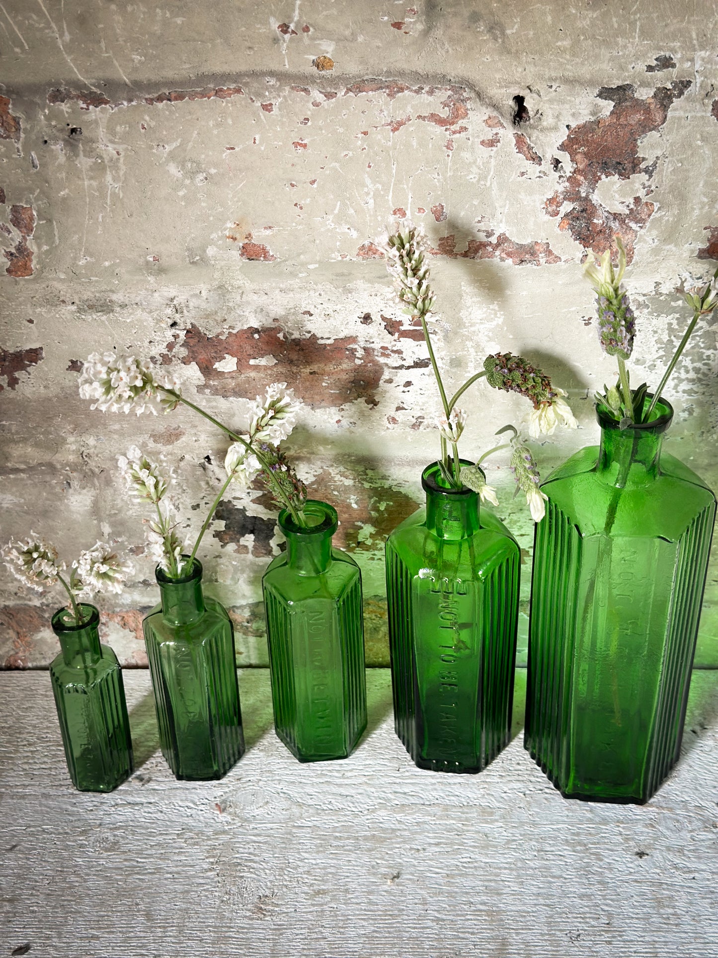 A set of Five lovely antique green poison bottles