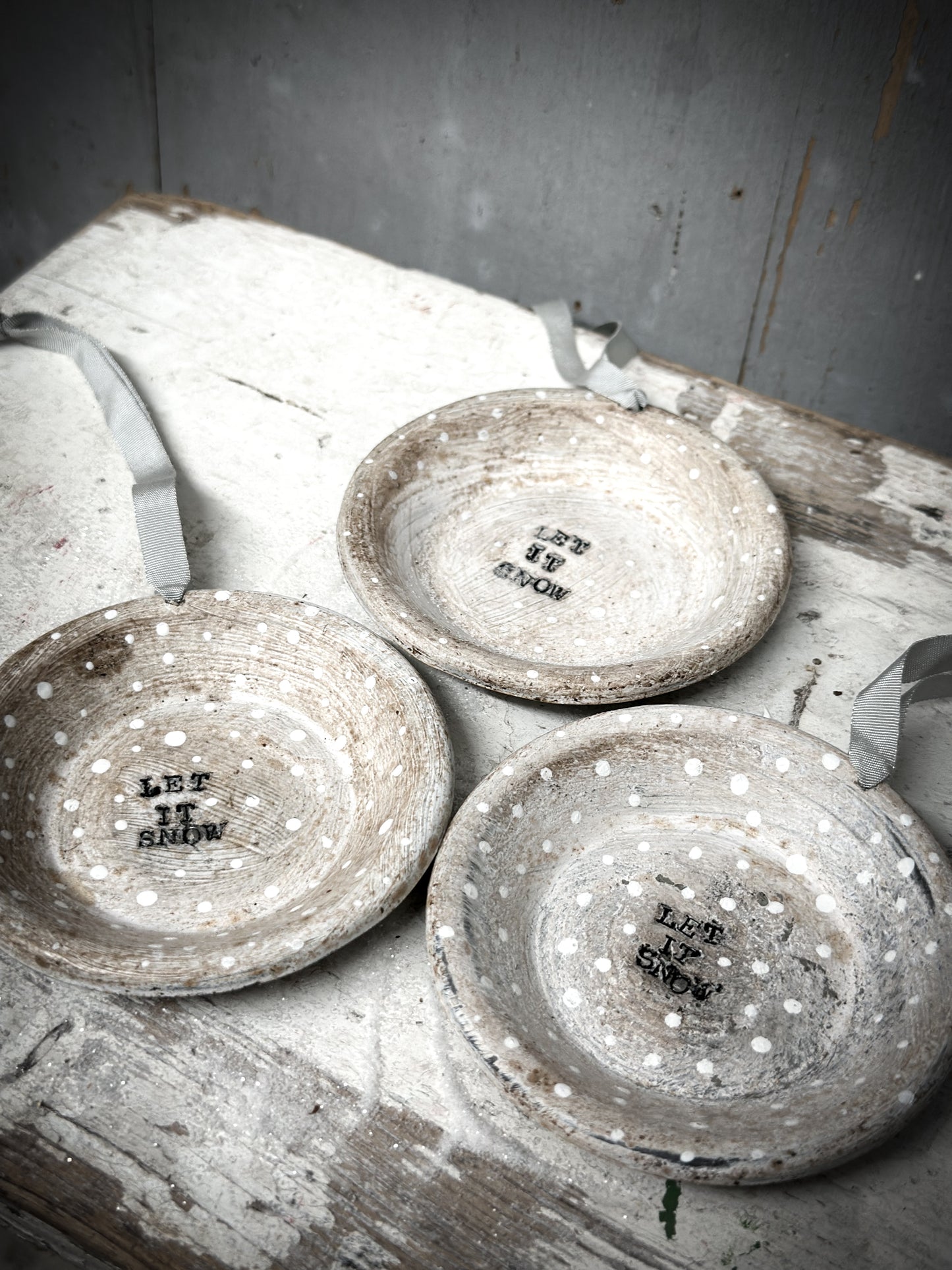 A Reworked French Patisserie Tin Christmas Decoration Stamped and Painted “Let It Snow”