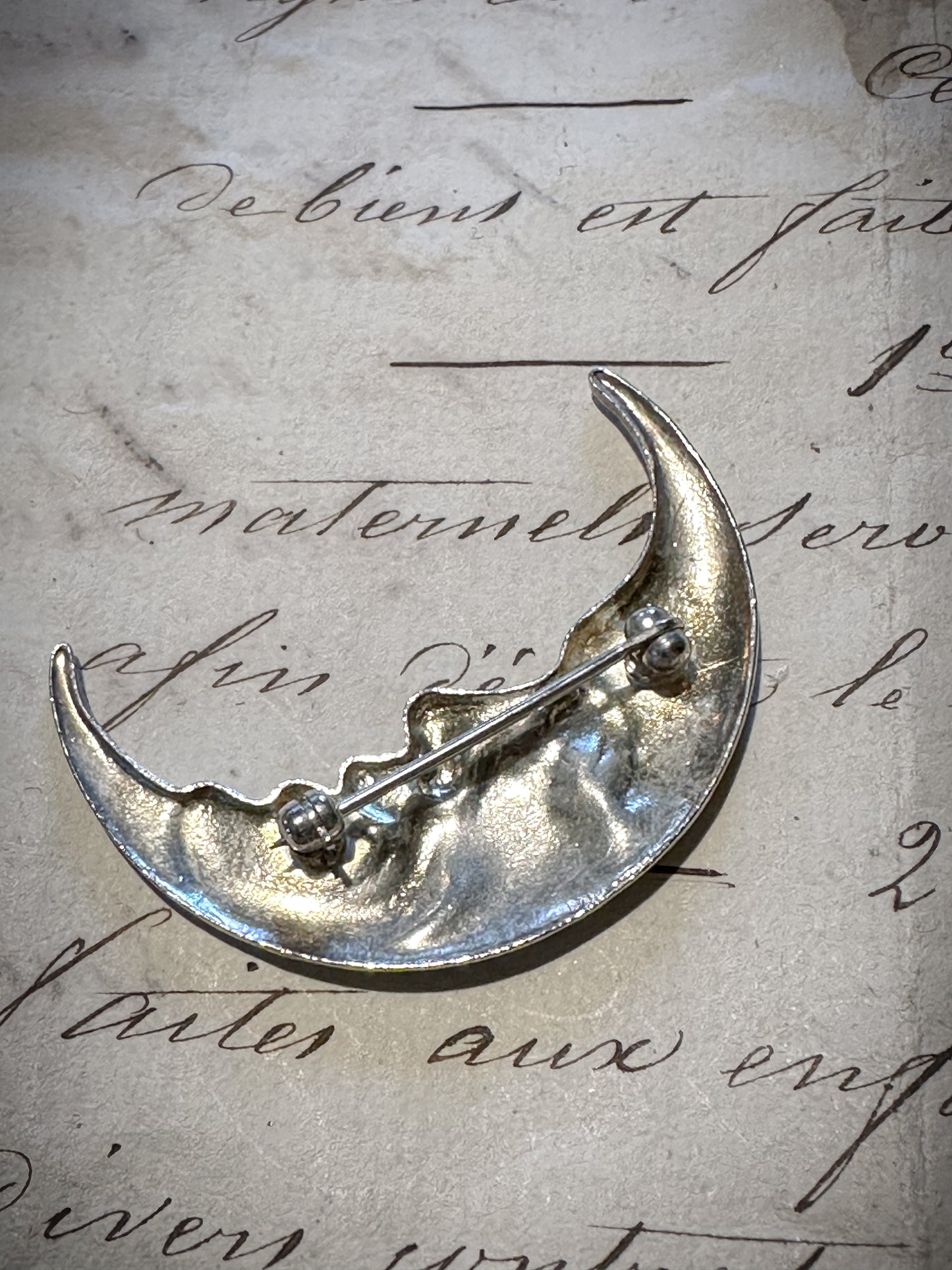Fabulous white metal man in the moon crescent brooch