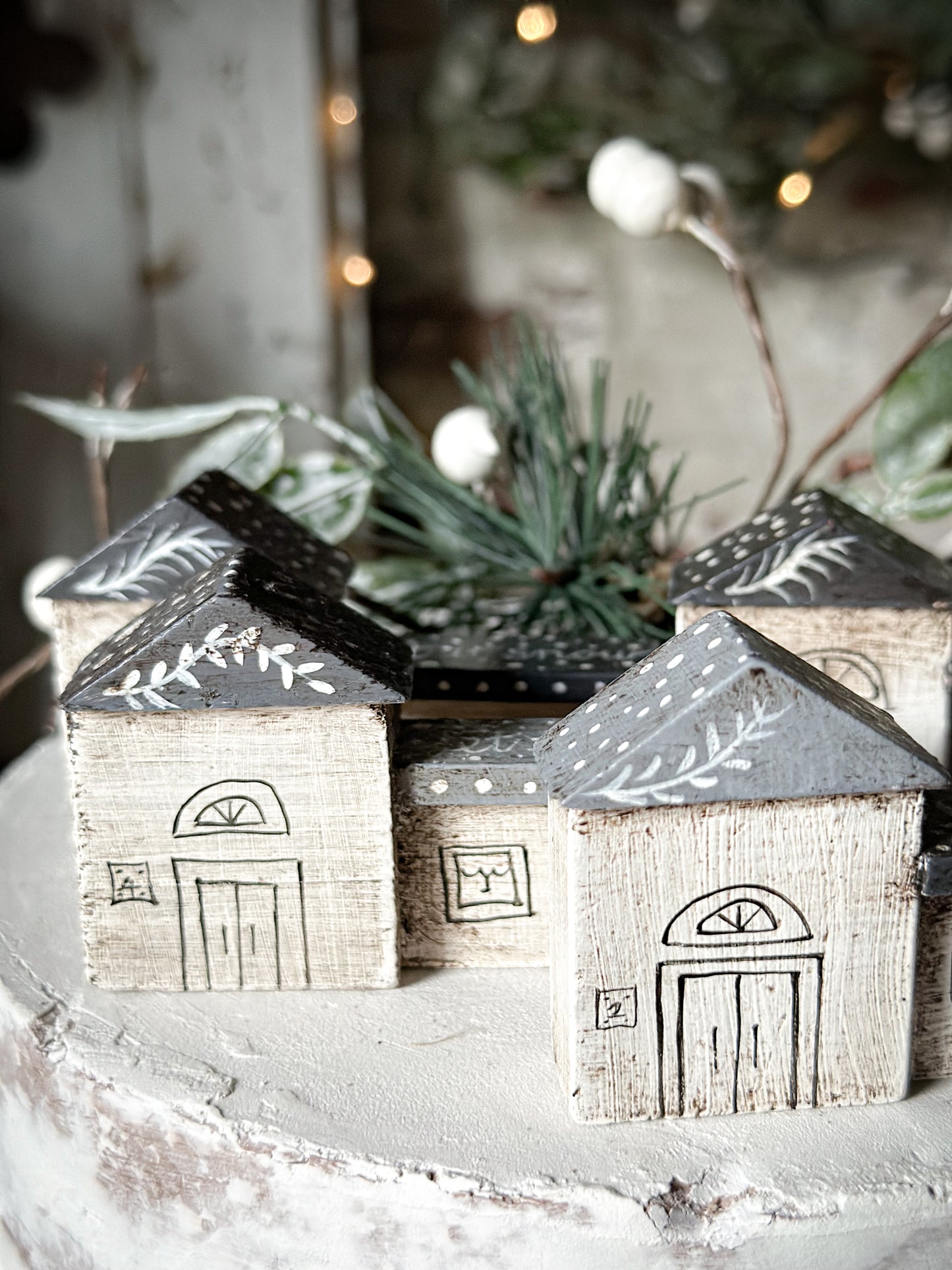 A pretty vintage German Erzgebirge Putz wooden village house painted with a Christmas quote