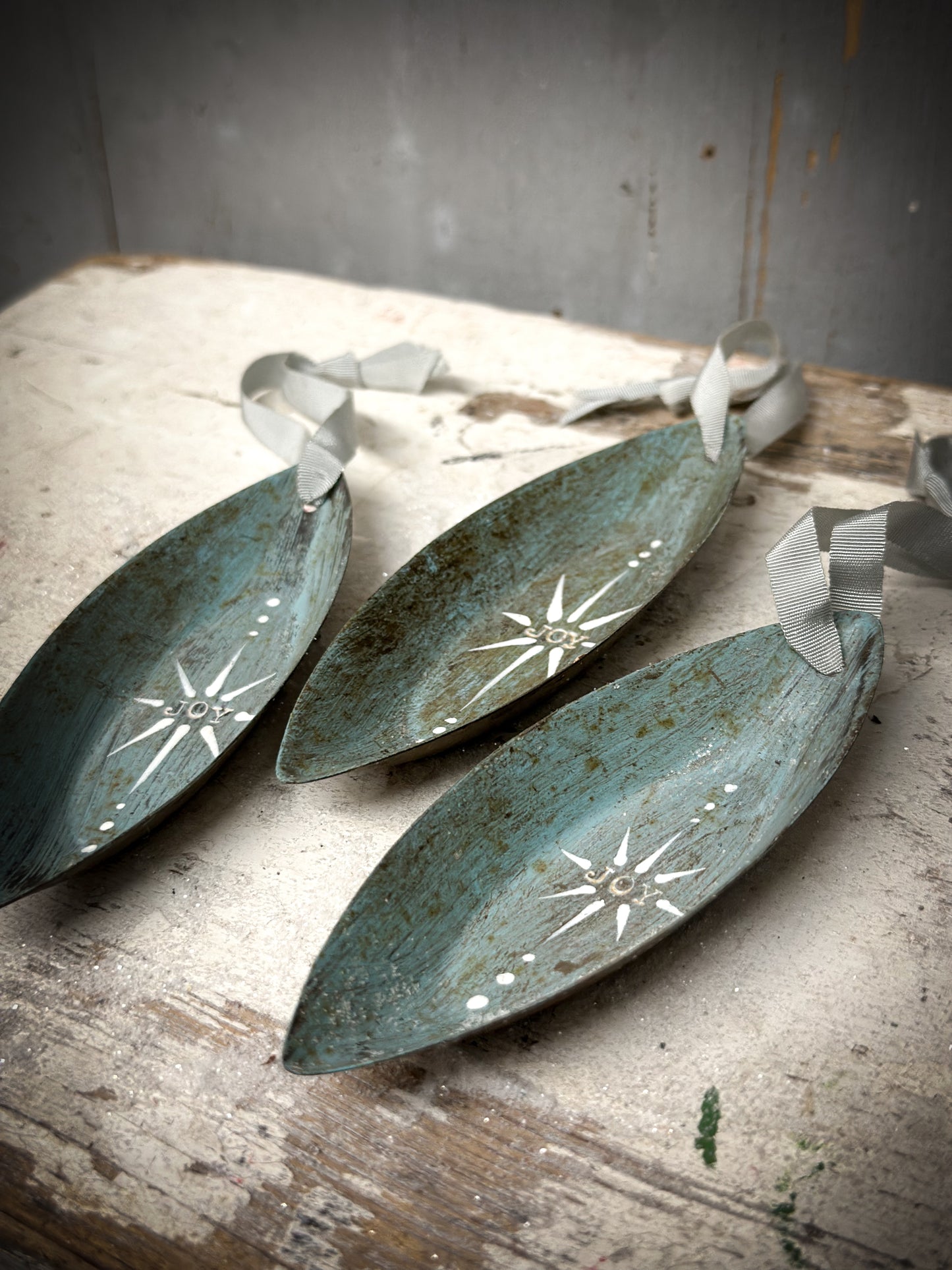 A Reworked French Patisserie Tin Christmas Decoration Stamped and Painted “Joy”