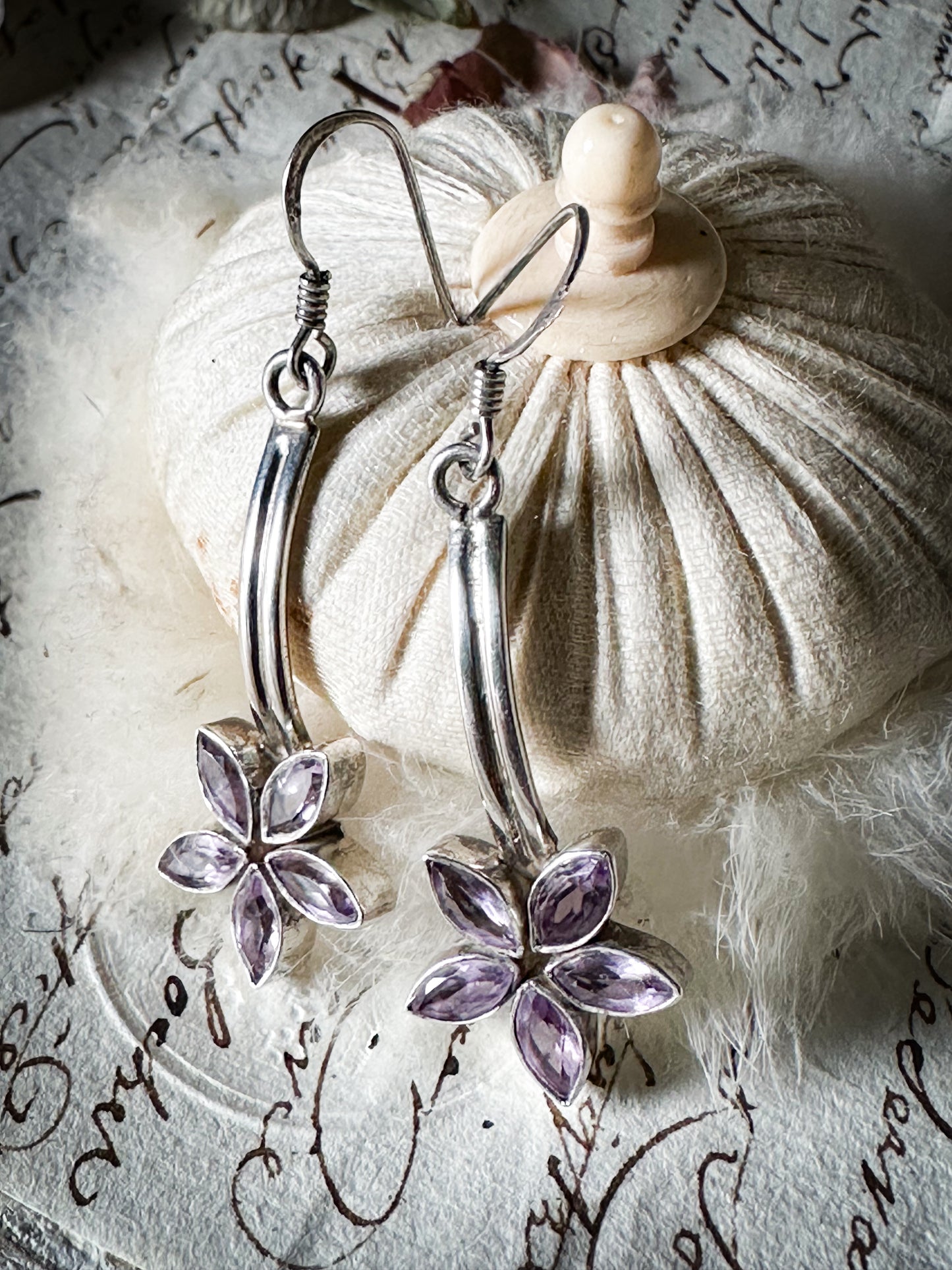 A pair of vintage silver amethyst flower drop earrings