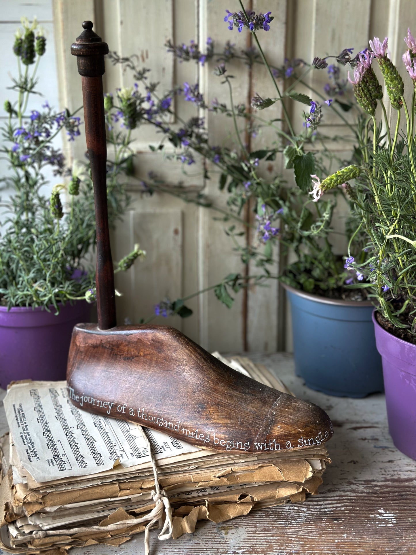 An antique wooden painted adult’s shoe last.