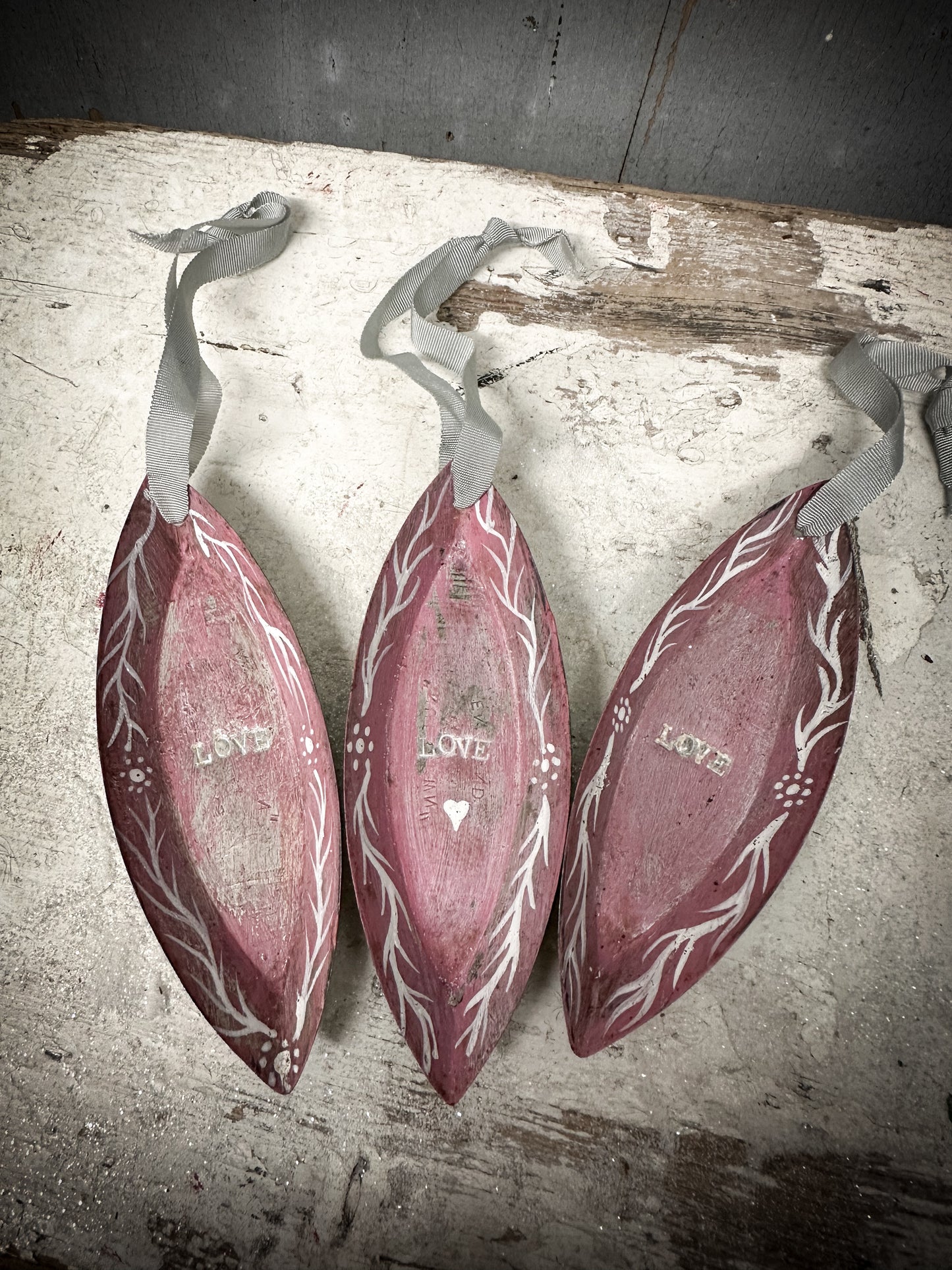 A Reworked French Patisserie Tin Christmas Decoration Stamped and Painted “love”