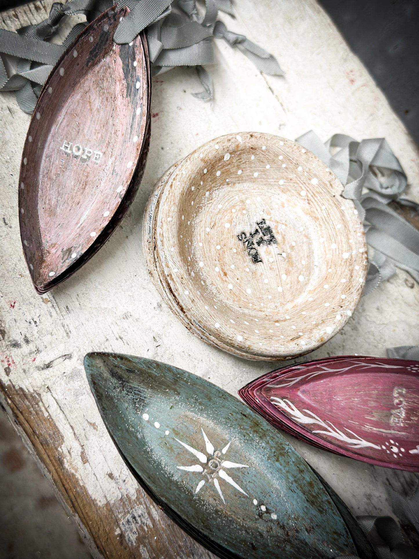 A Reworked French Patisserie Tin Christmas Decoration Stamped and Painted “Let It Snow”