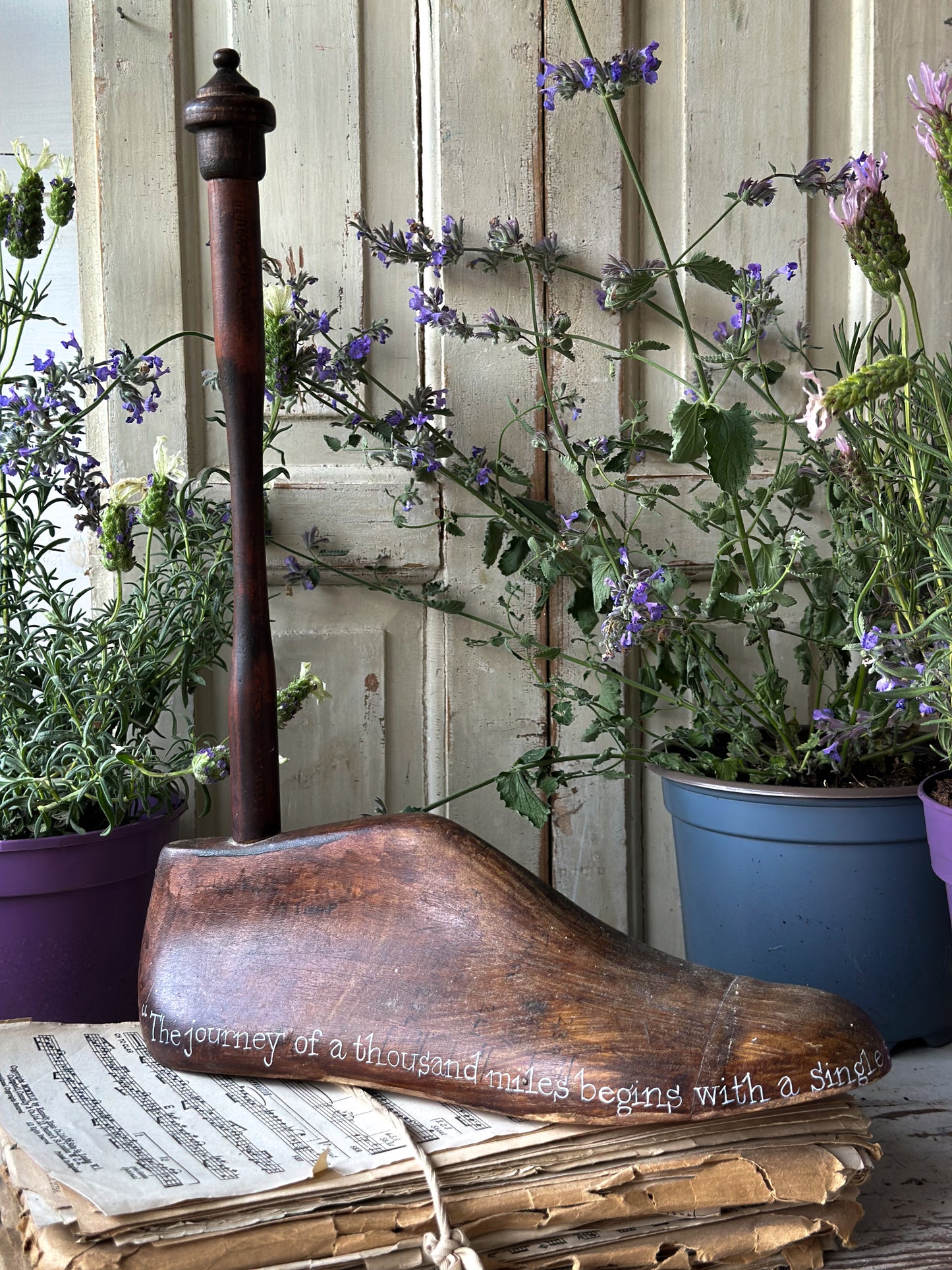 An antique wooden painted adult’s shoe last.