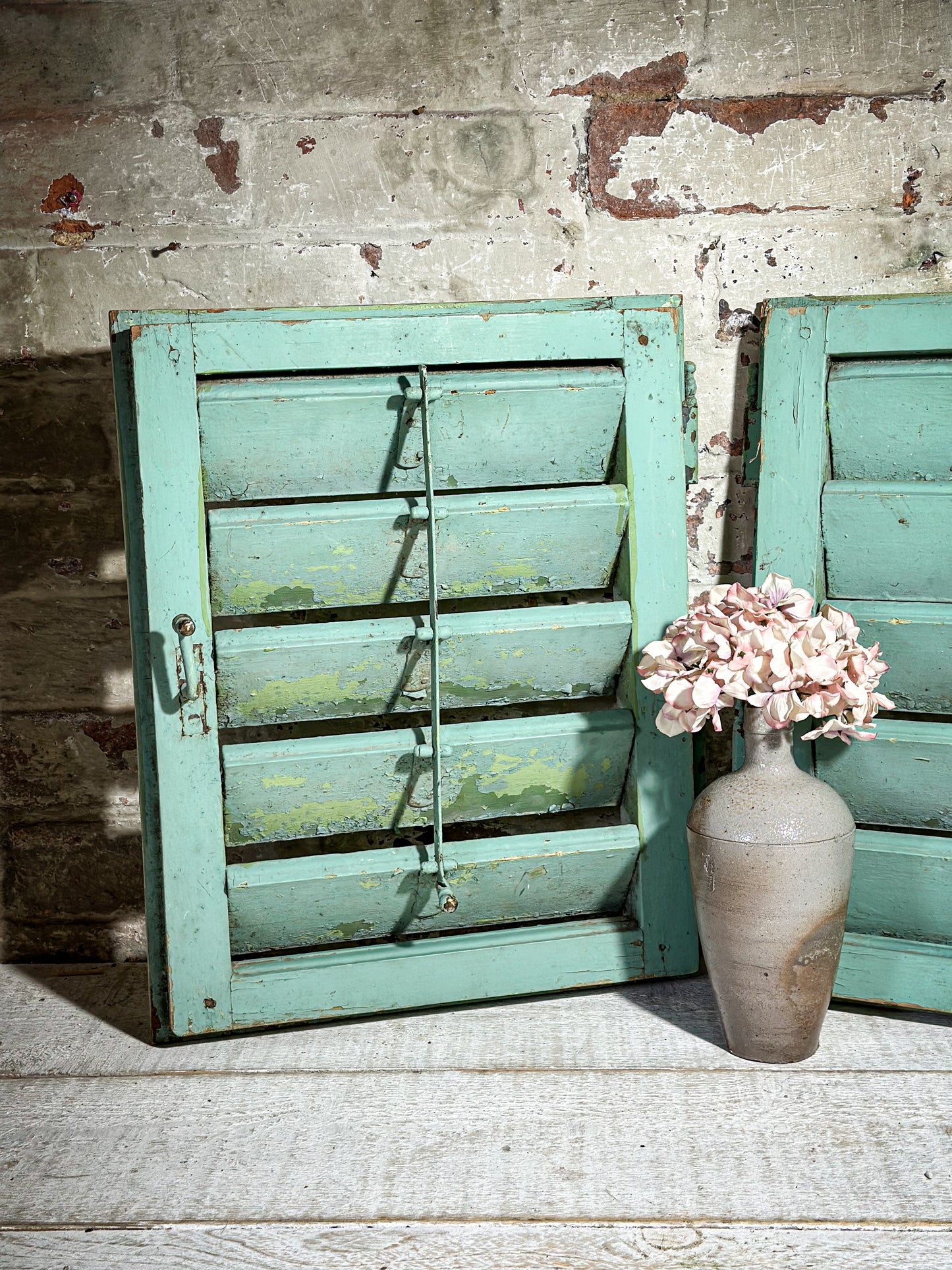 A Pair of French Green Chippy Painted Shutters