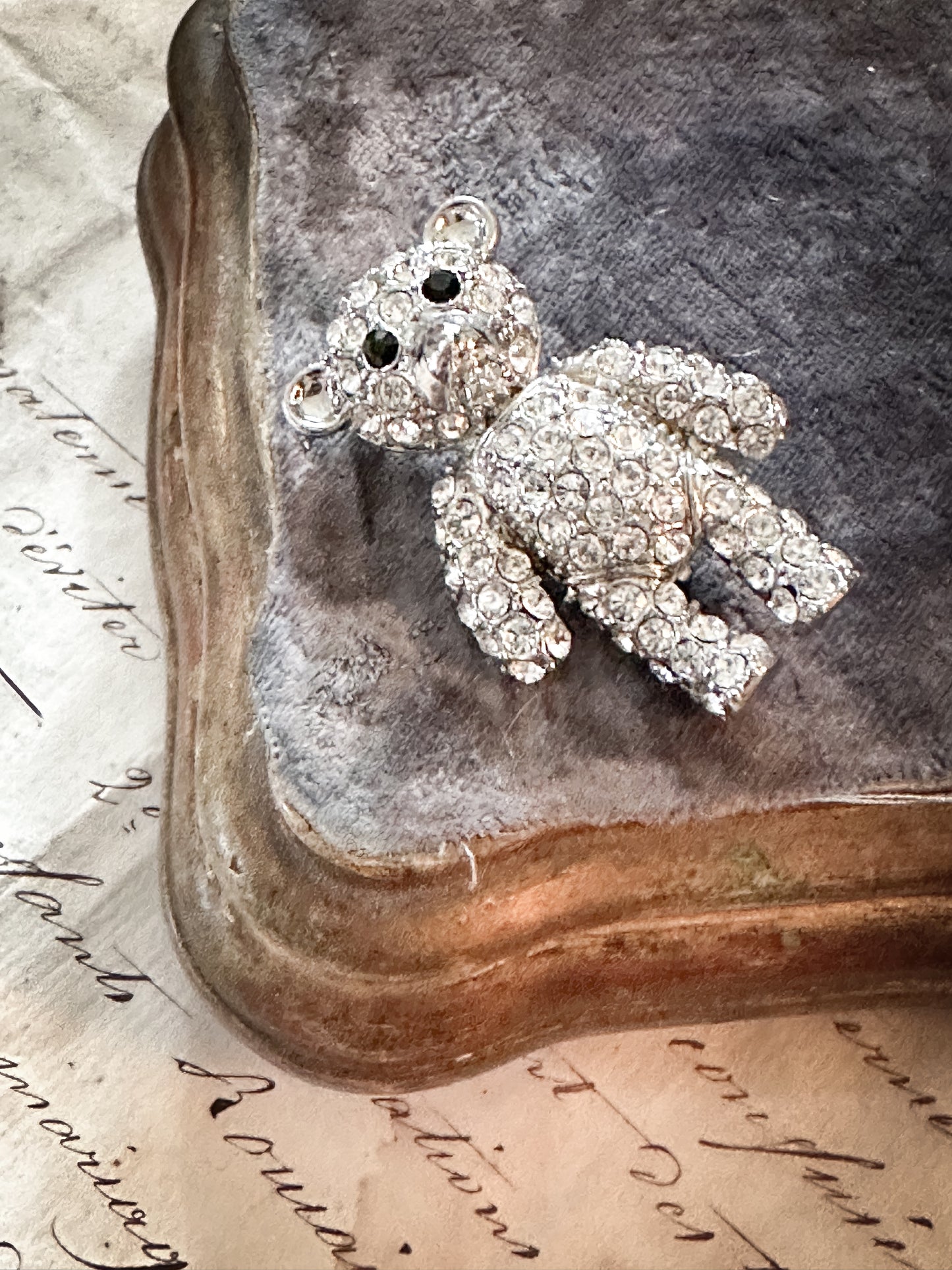 A sweet vintage diamanté teddy bear brooch