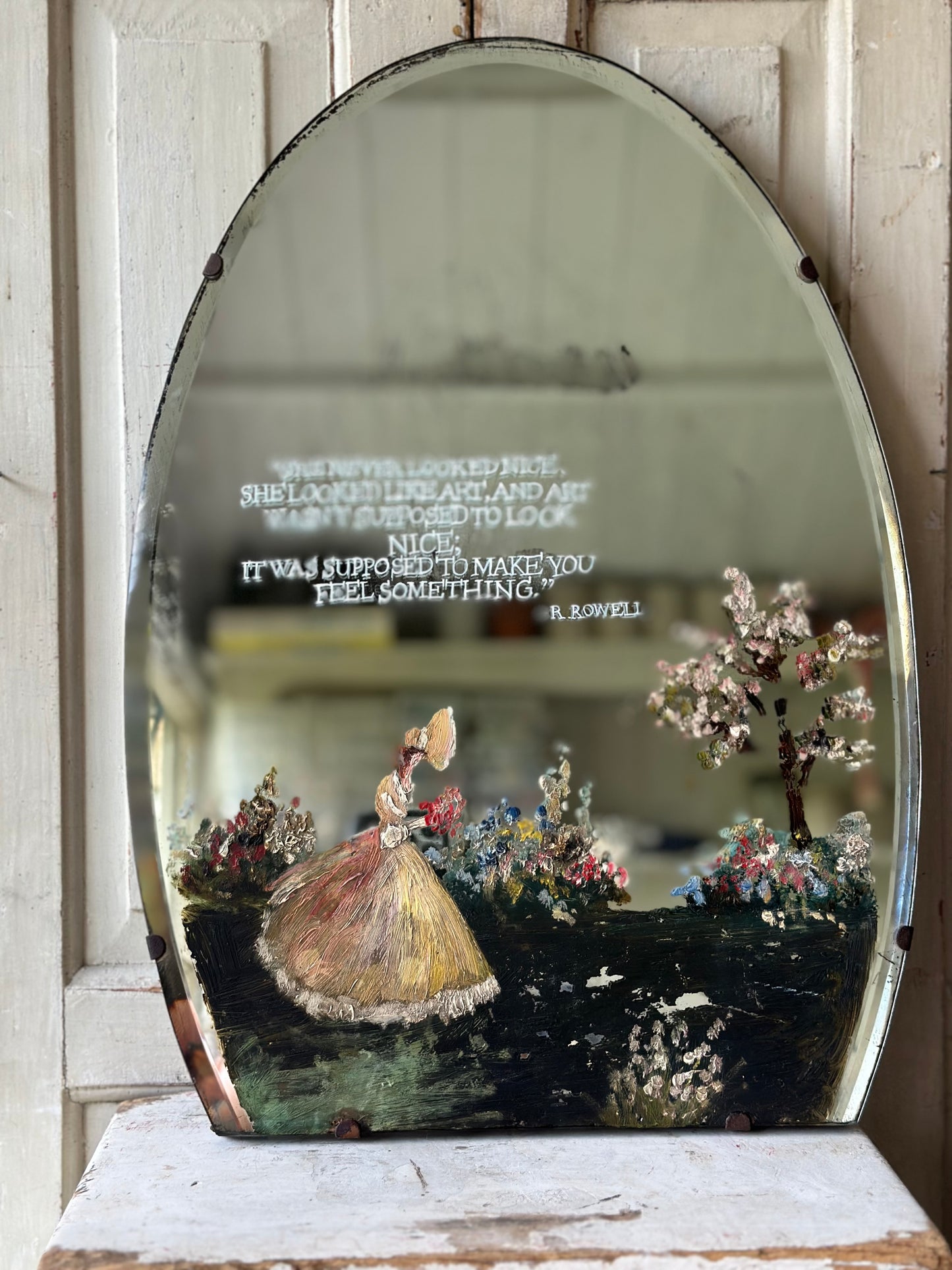 A beautiful antique painted mirror with a hand painted quote