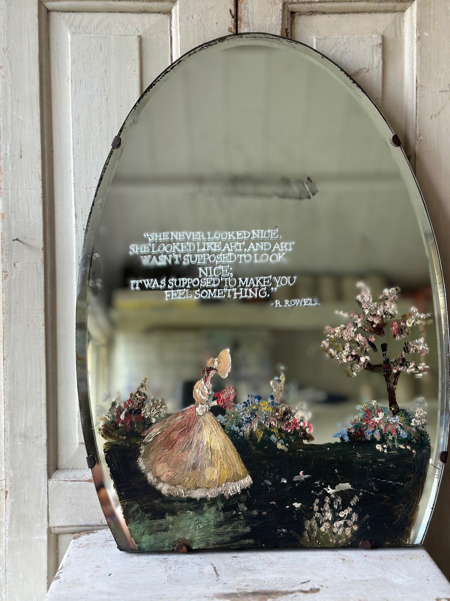 A beautiful antique painted mirror with a hand painted quote