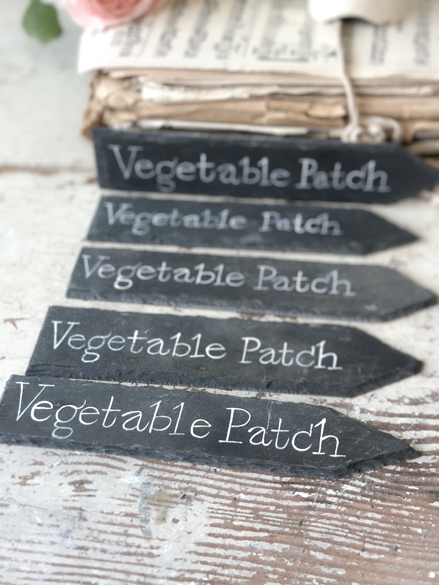 A small hand painted Victorian Welsh slate sign in lower case “Vegetable Patch”