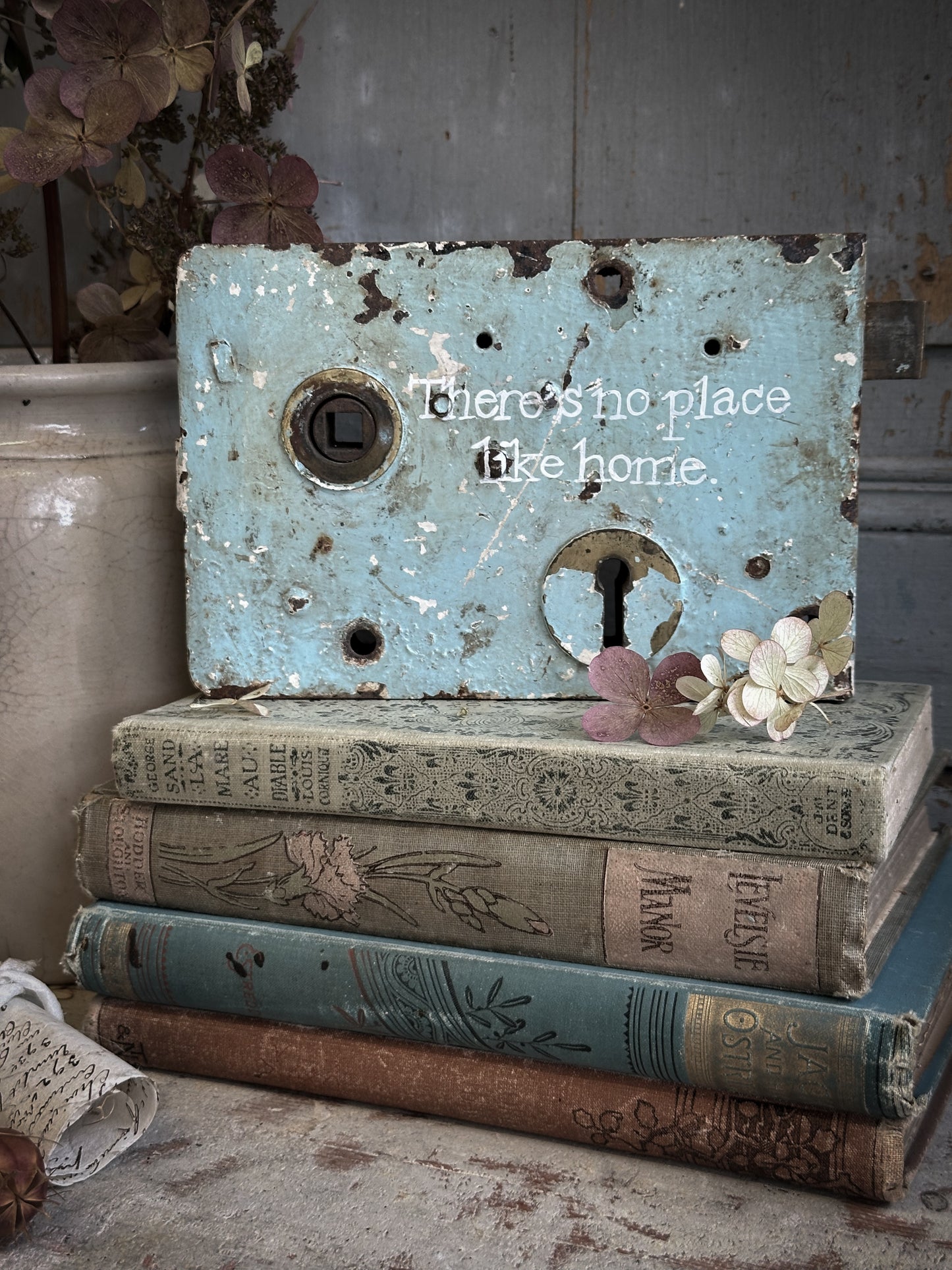An Antique Lock With Hand Painted Quote