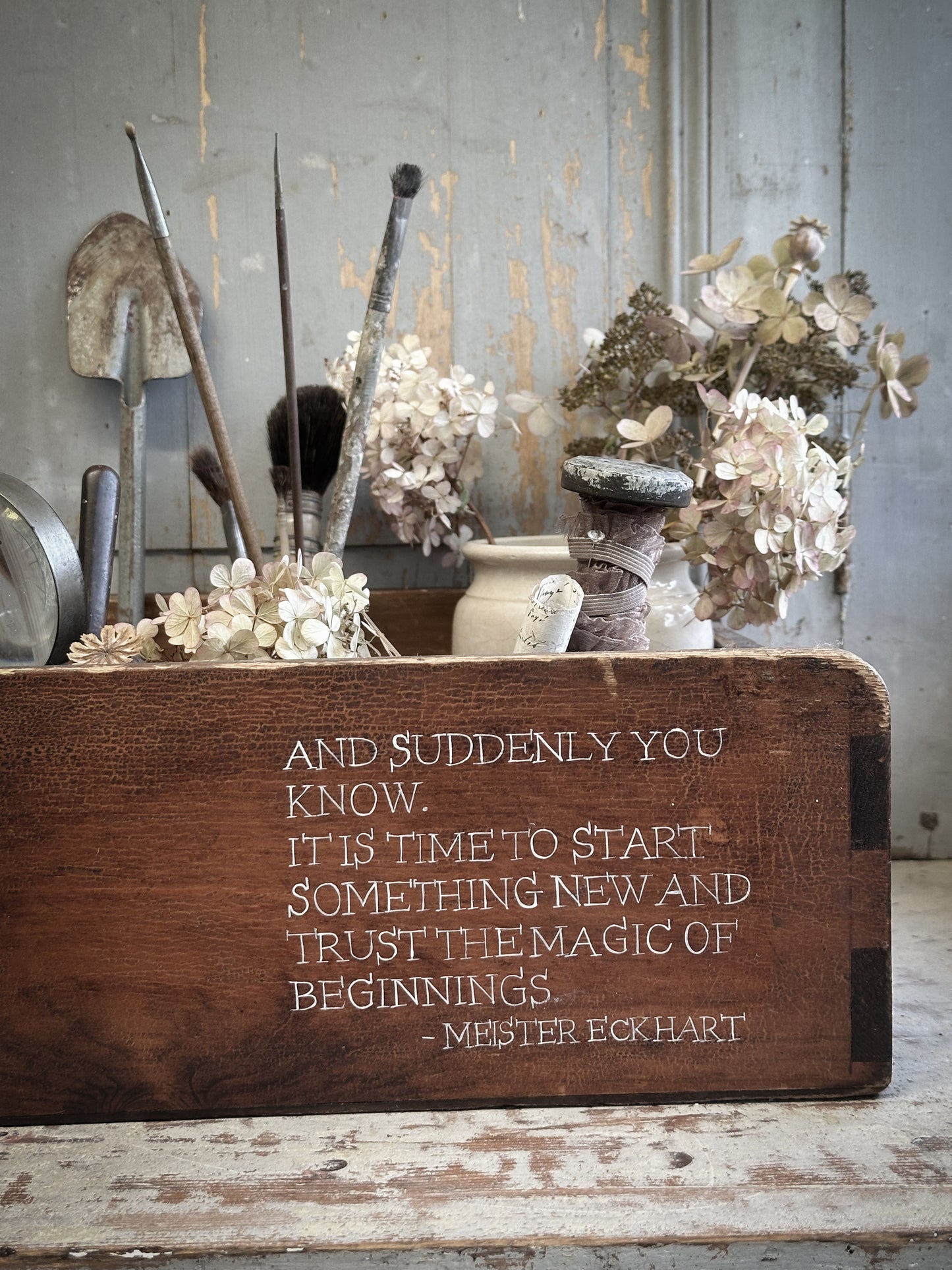 A Vintage Wooden Drawer With Hand Painted Quote
