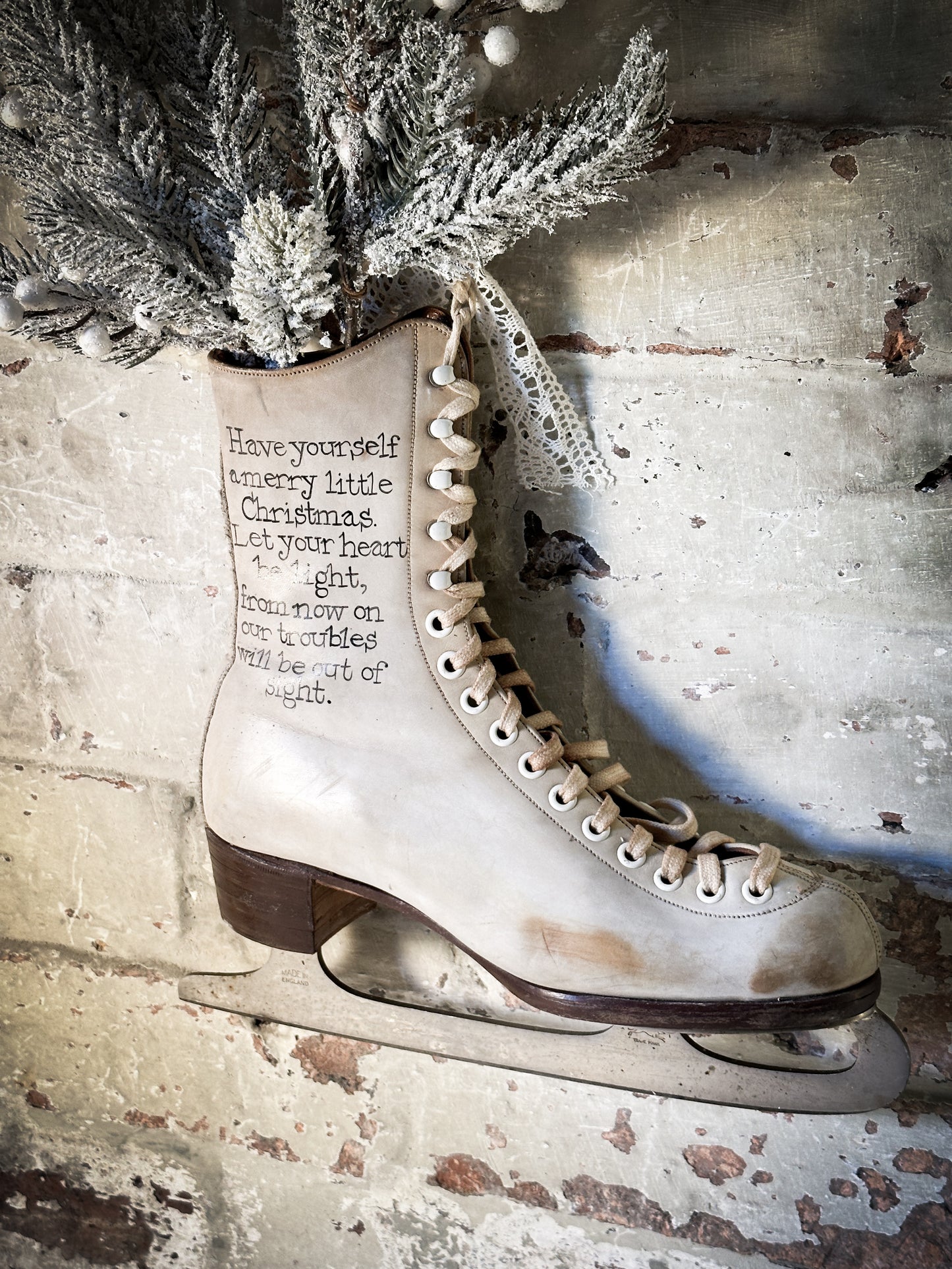A beautiful vintage Christmas ice skate hand painted using traditional sign writer’s techniques and materials