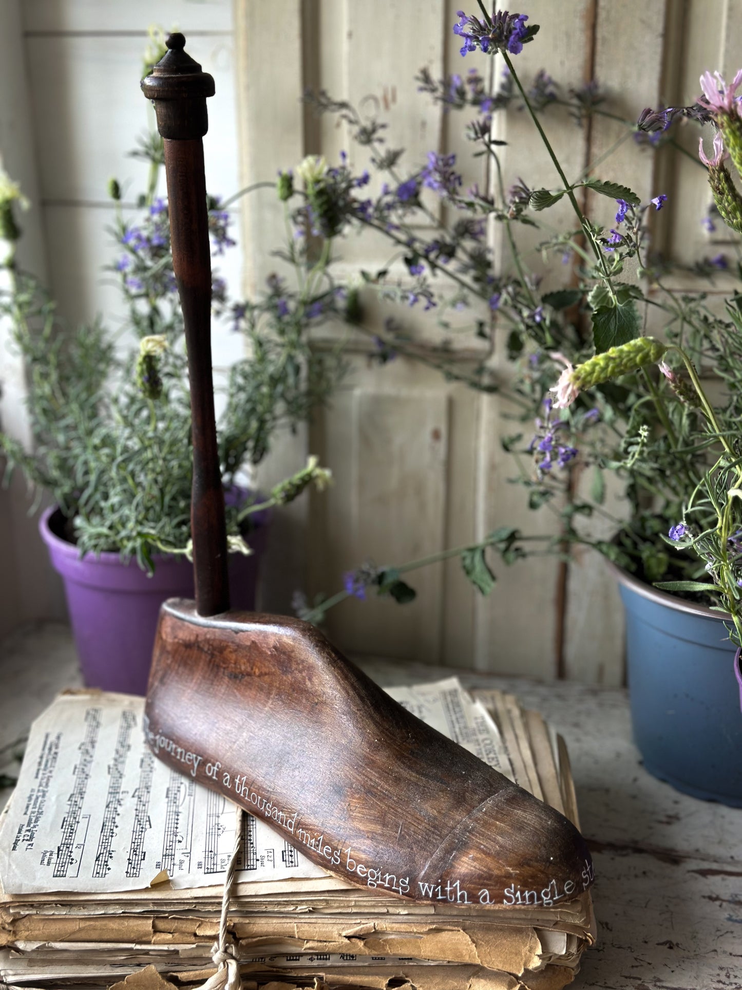 An antique wooden painted adult’s shoe last.