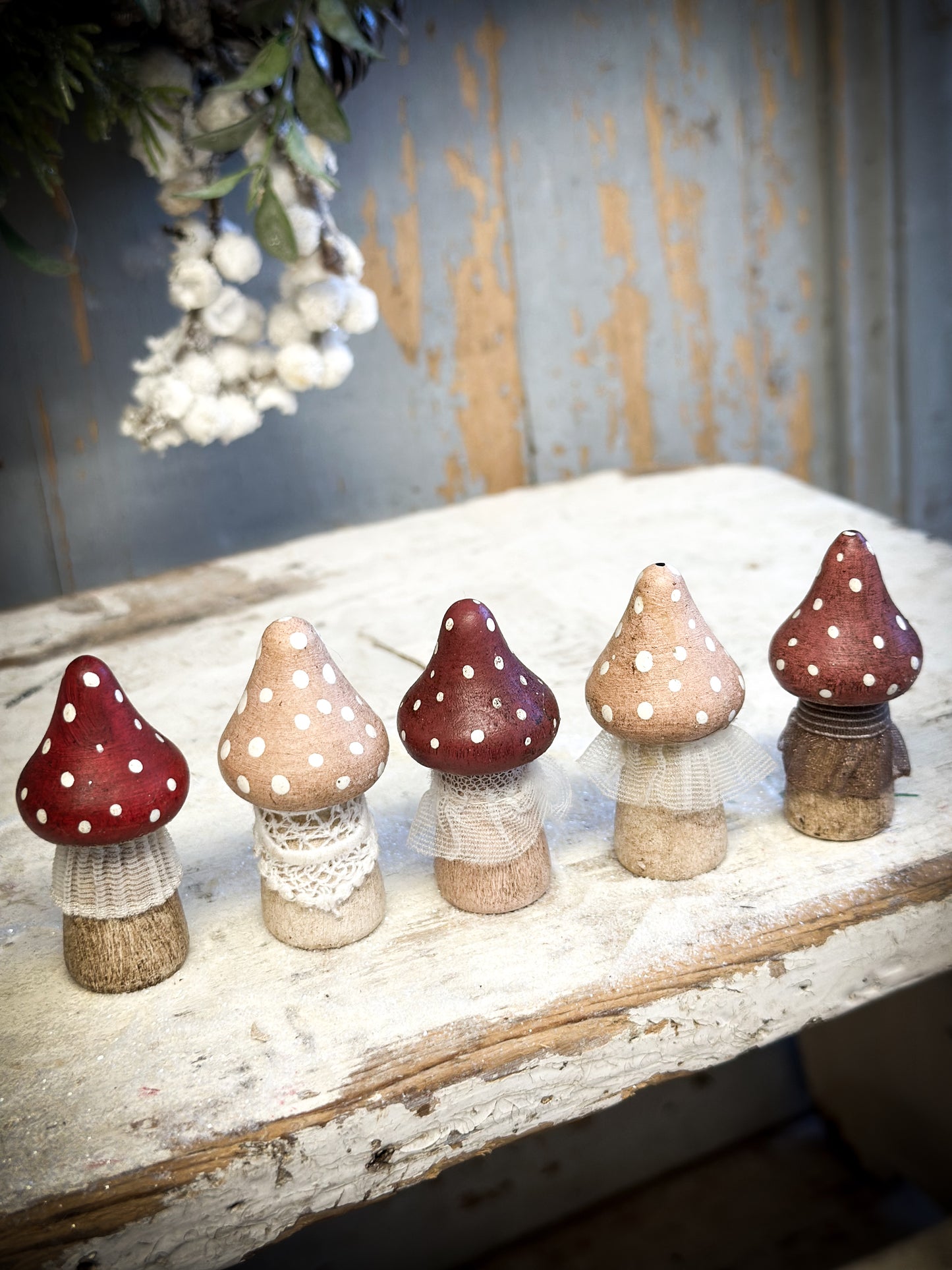 A wooden hand painted and trimmed Christmas village toadstool medium pointy one